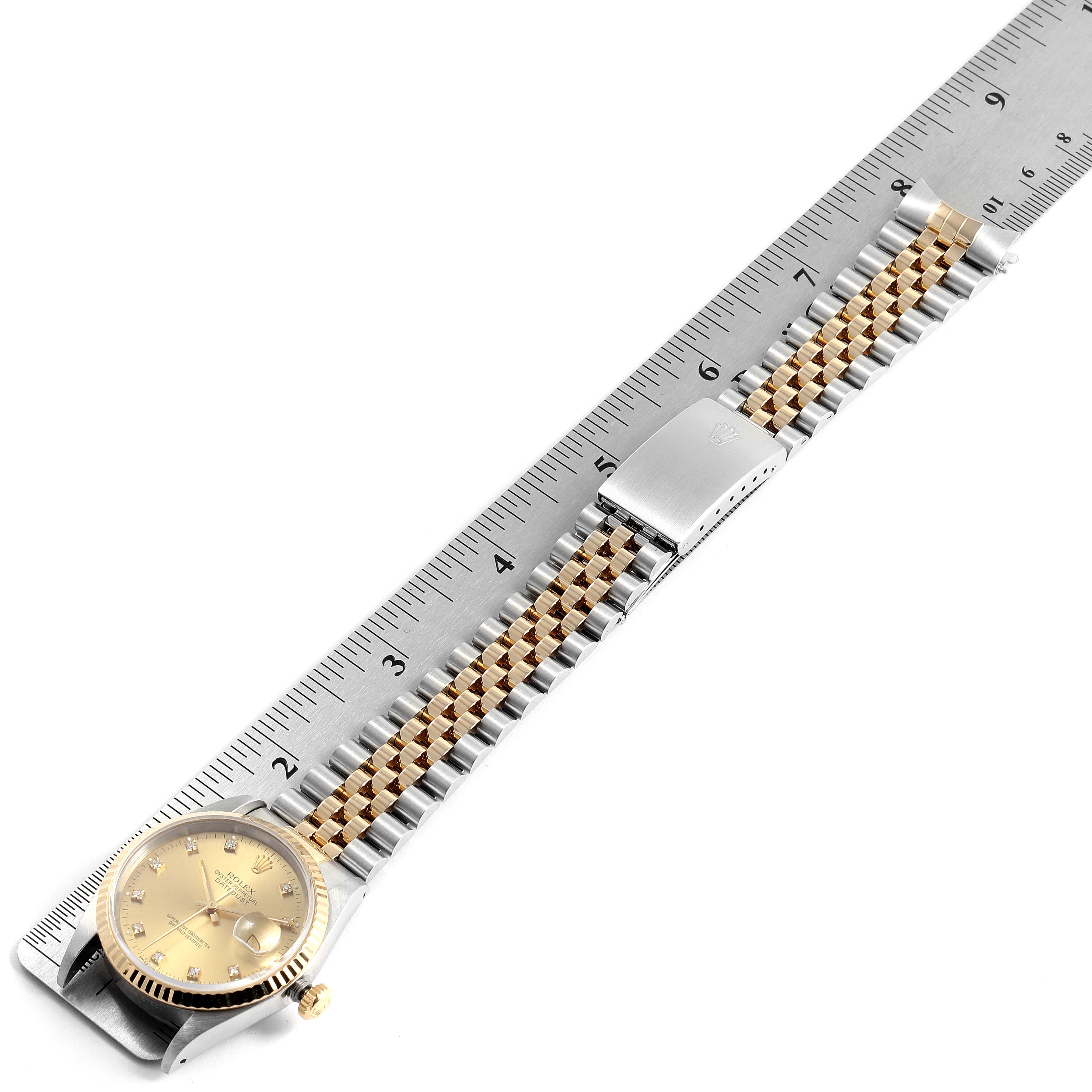 The image shows a Rolex Datejust 16233 Men's Steel and Gold (two tone) Champagne Dial 16233 Men's Steel and Gold (two tone) Champagne Dial watch laid flat against a ruler, highlighting the dial and two-tone bracelet.