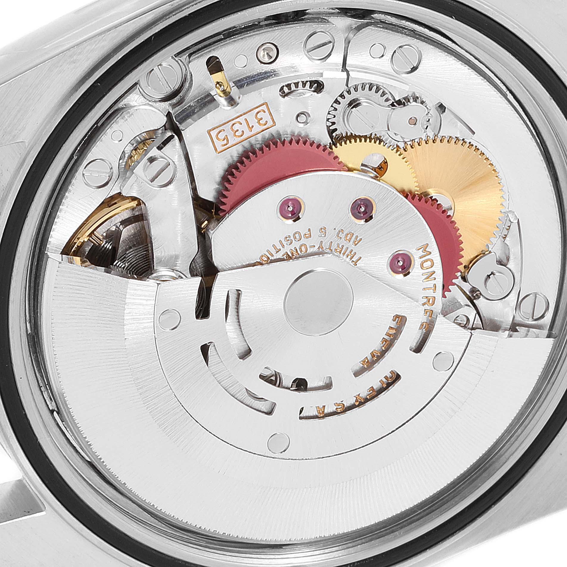 The image shows the internal mechanism of a Rolex Datejust 16233 Men's Steel and Gold (two tone) Champagne Dial 16233 Men's Steel and Gold (two tone) Champagne Dial watch, viewed from the back, displaying gears and the rotor.