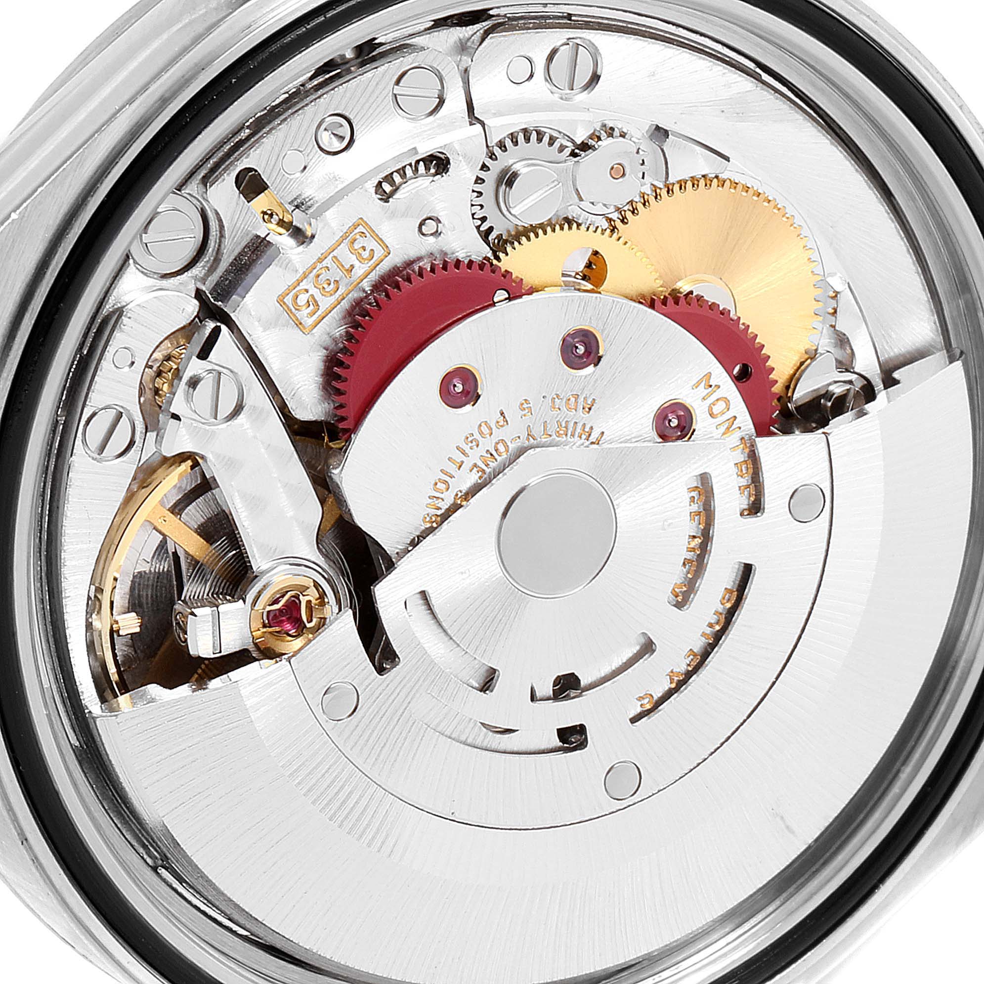 The image shows the intricate internal mechanism of a Rolex Datejust 16234 Men's Stainless Steel Silver Dial 16234 Men's Stainless Steel Silver Dial watch, highlighting the gears and movement parts from the back view.