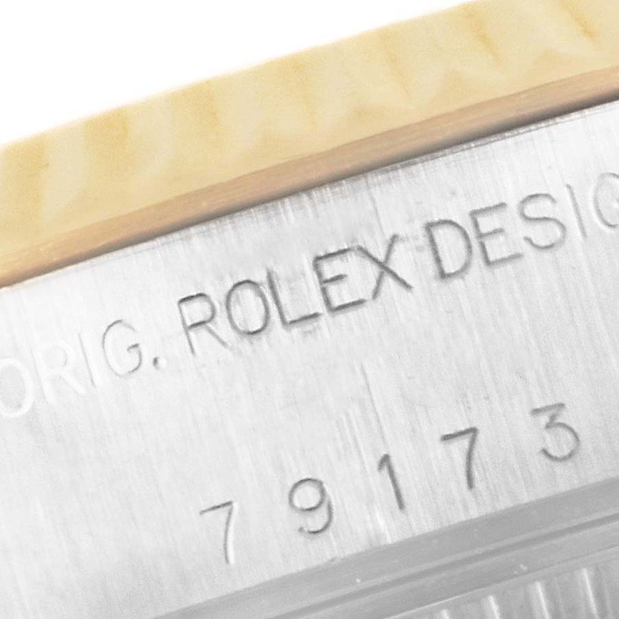 The image shows a close-up of the model number and "Rolex" engraving on the side of the Rolex Datejust 79173 Women's Steel and Gold (two tone) Mother of Pearl Dial 79173 Women's Steel and Gold (two tone) Mother of Pearl Dial watch case.