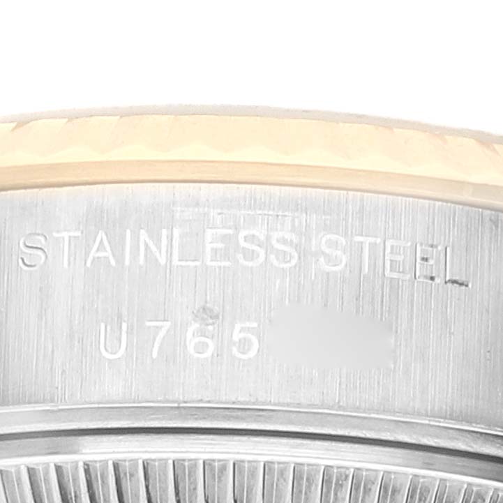This image shows a close-up of the side of a Rolex Datejust 69173 Women's Steel and Gold (two tone) White Dial 69173 Women's Steel and Gold (two tone) White Dial watch, highlighting the "STAINLESS STEEL" engraving.
