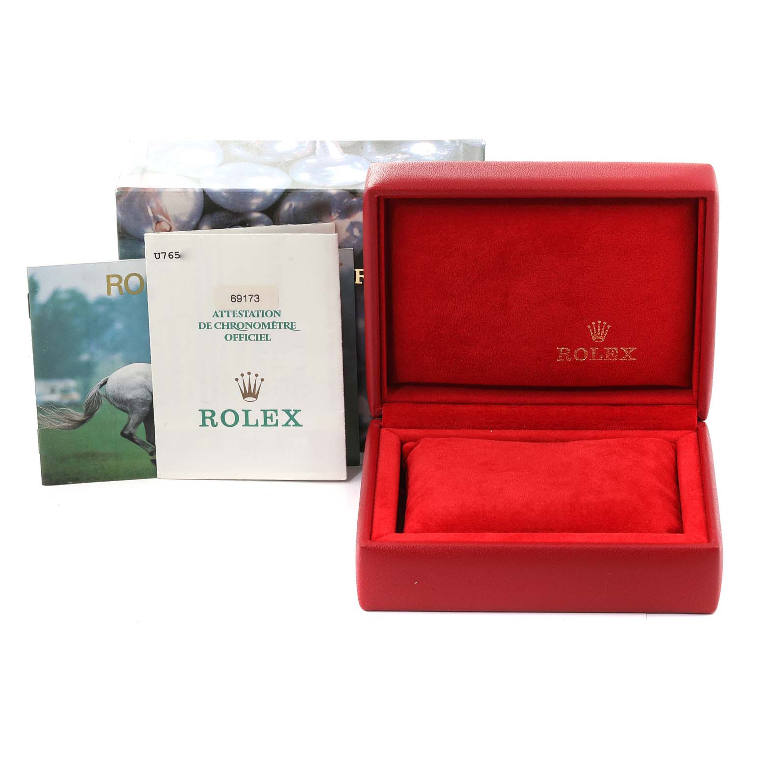 This image shows the empty red box, manuals, and documents for the Rolex Datejust 69173 Women's Steel and Gold (two tone) White Dial 69173 Women's Steel and Gold (two tone) White Dial model.