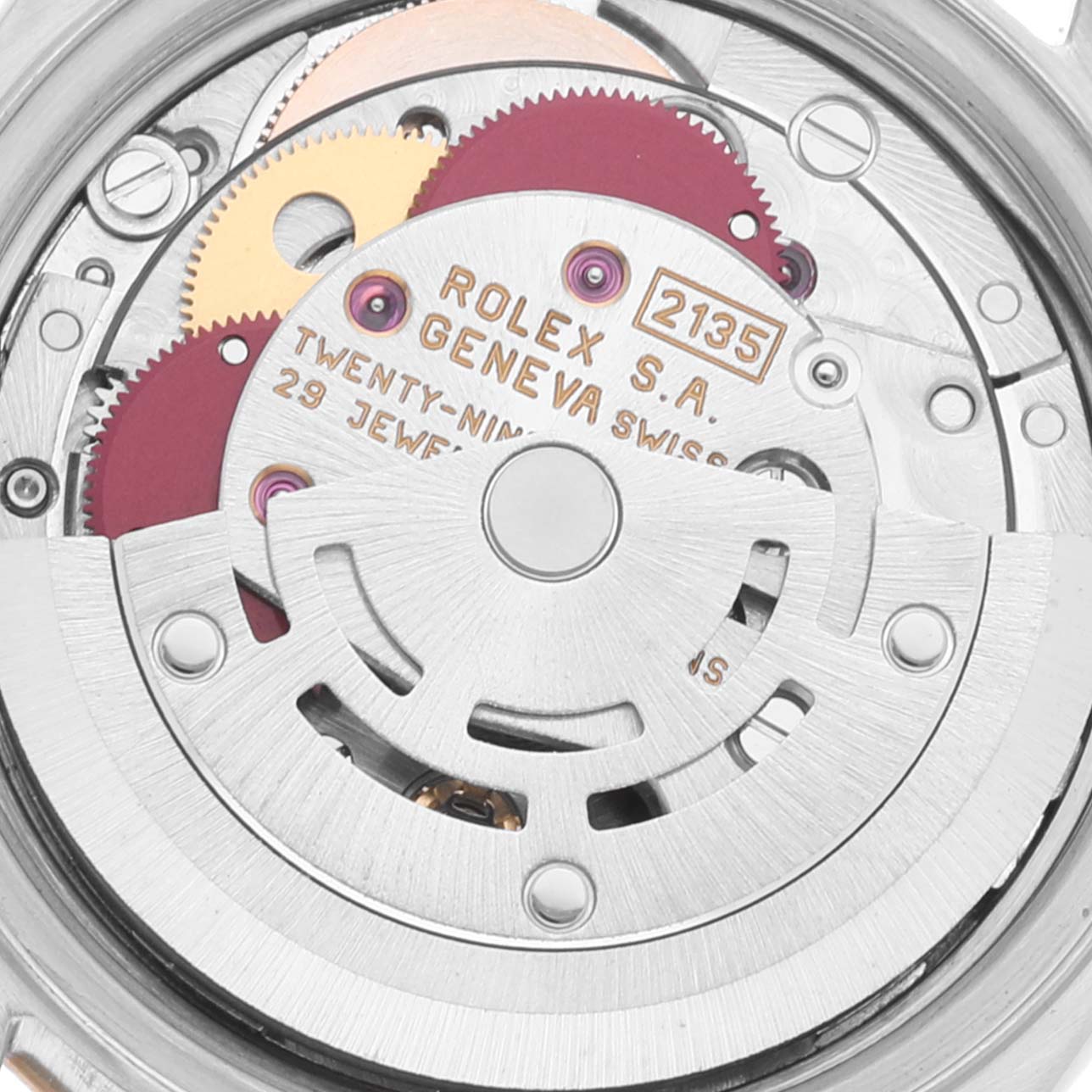 This image shows the internal mechanism and movement of the Rolex Datejust 69173 Women's Steel and Gold (two tone) White Dial 69173 Women's Steel and Gold (two tone) White Dial model watch, including gears and engravings.
