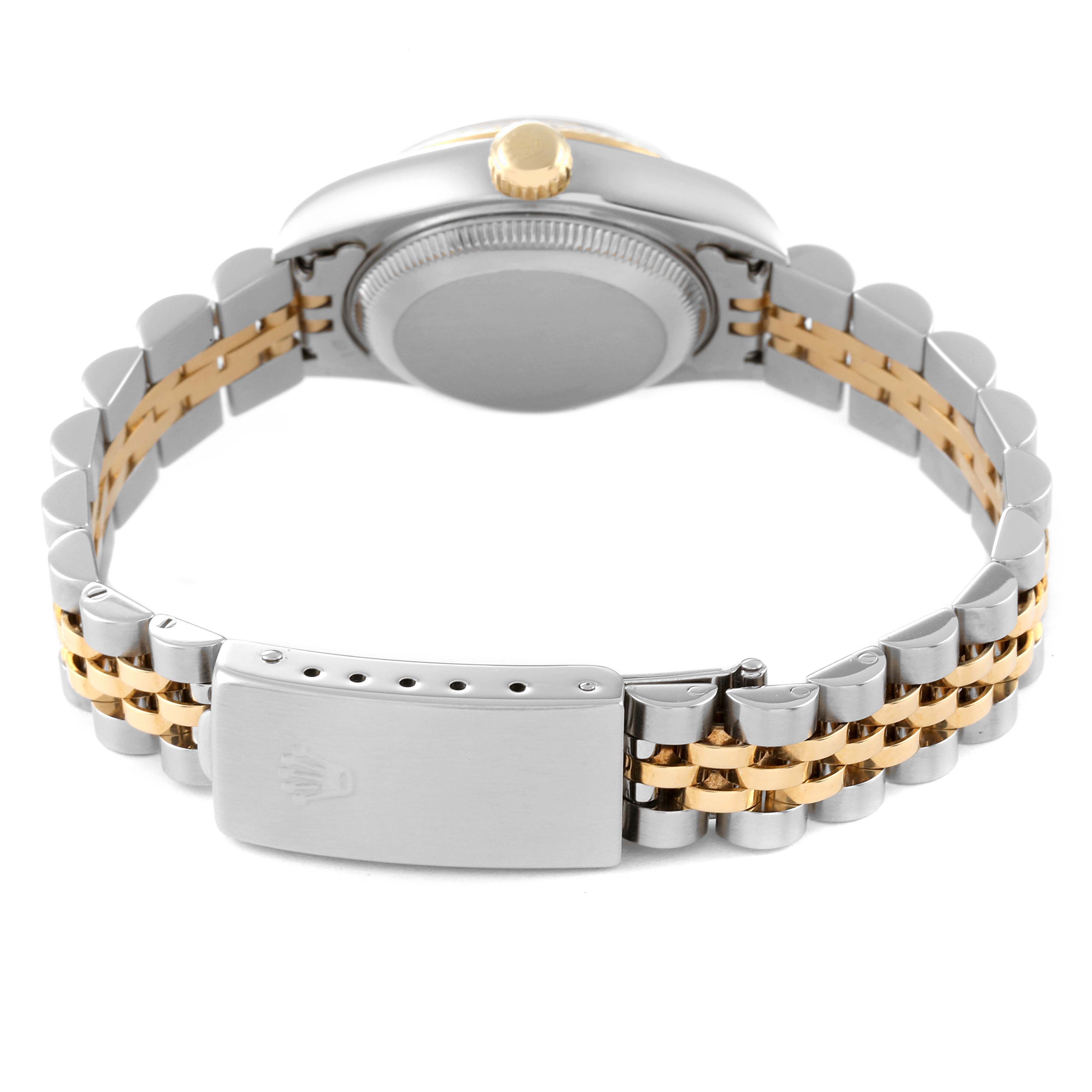 The image shows the back view of a Rolex Datejust 79173 Women
s Steel and Gold (two tone) Red Dial 79173 Women
s Steel and Gold (two tone) Red Dial watch, focusing on the case back, crown, and two-tone bracelet with clasp.