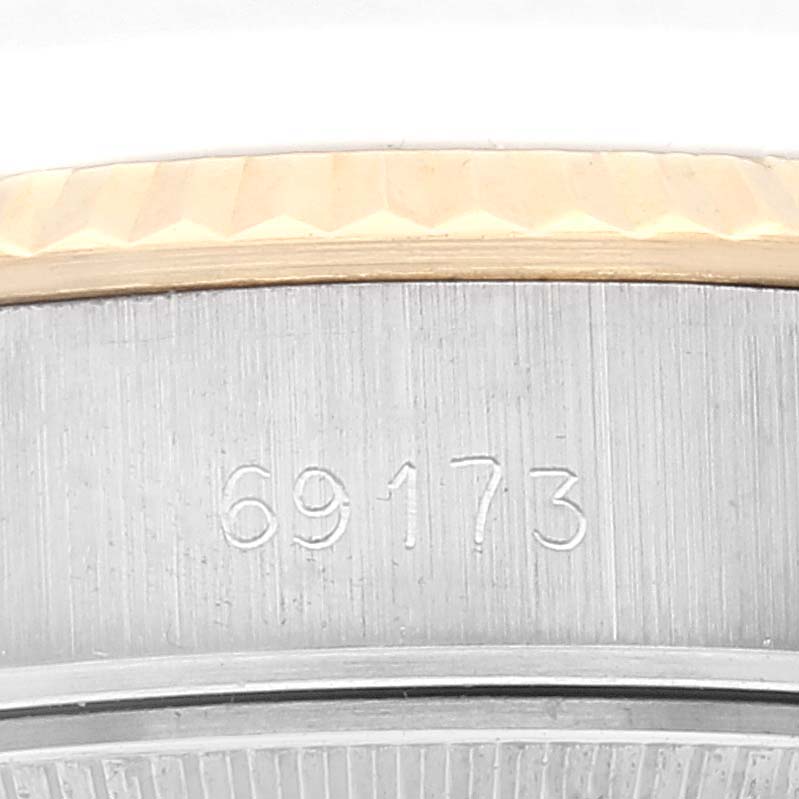 This image shows a close-up of the side of a Rolex Datejust 69173 Women's Steel and Gold (two tone) White Dial 69173 Women's Steel and Gold (two tone) White Dial watch, highlighting the engraved model number 69173.
