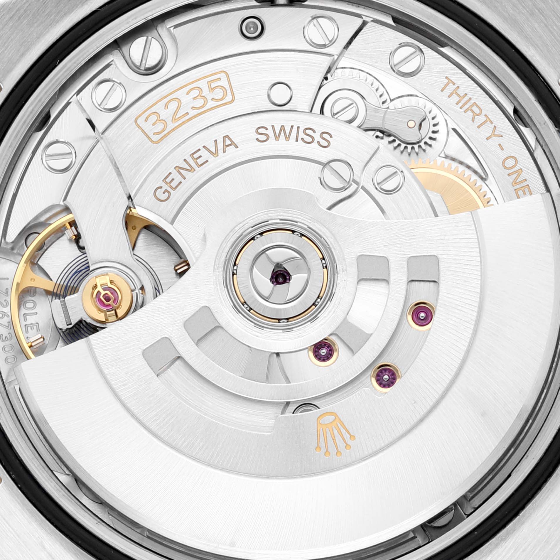 This image shows the movement and internal mechanisms of a Rolex Datejust 126233 Men's Steel and Gold (two tone) White Dial 126233 Men's Steel and Gold (two tone) White Dial watch from a rear angle.