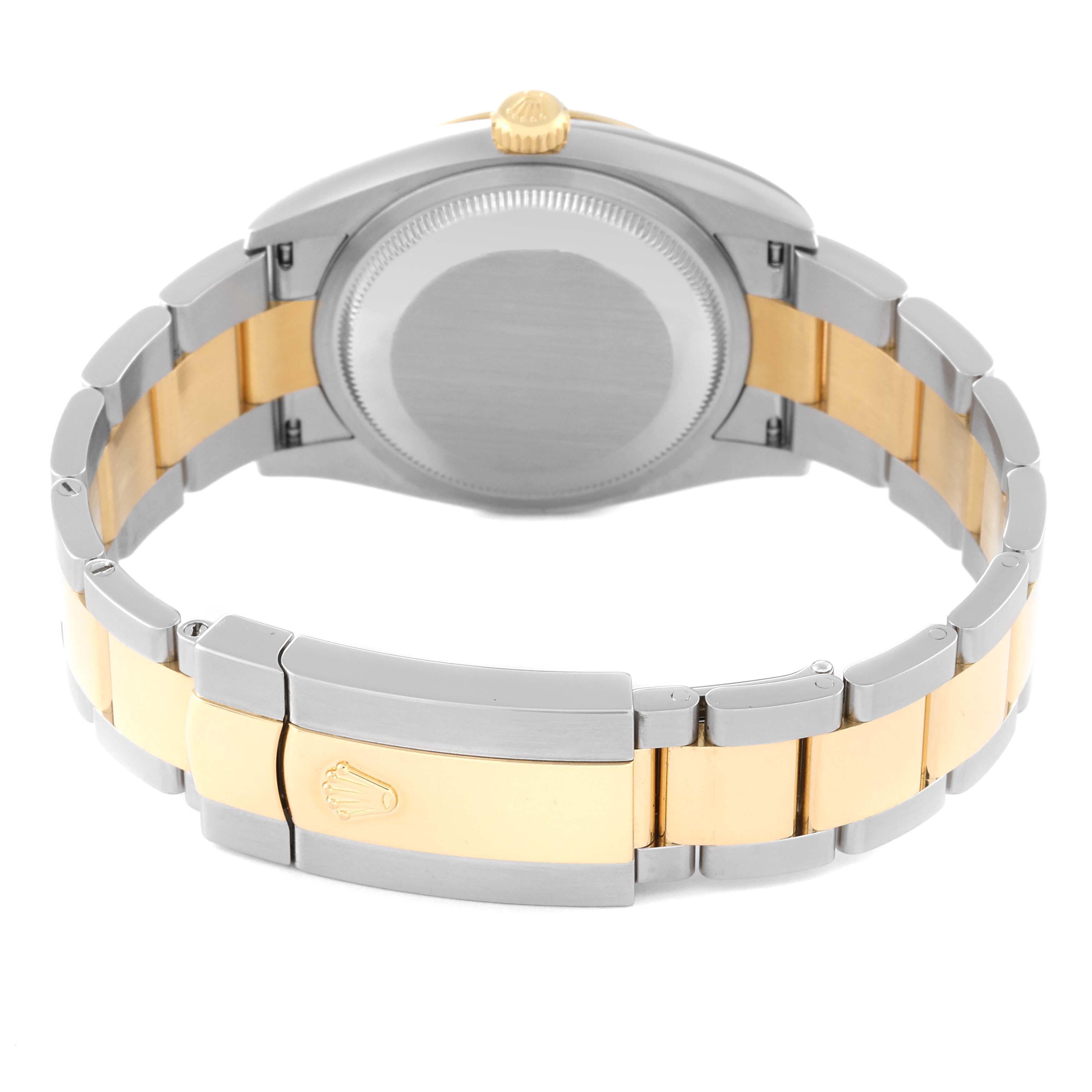 The image shows the back side of a Rolex Datejust 126233 Men's Steel and Gold (two tone) White Dial 126233 Men's Steel and Gold (two tone) White Dial watch, highlighting its clasp, bracelet, and case back.