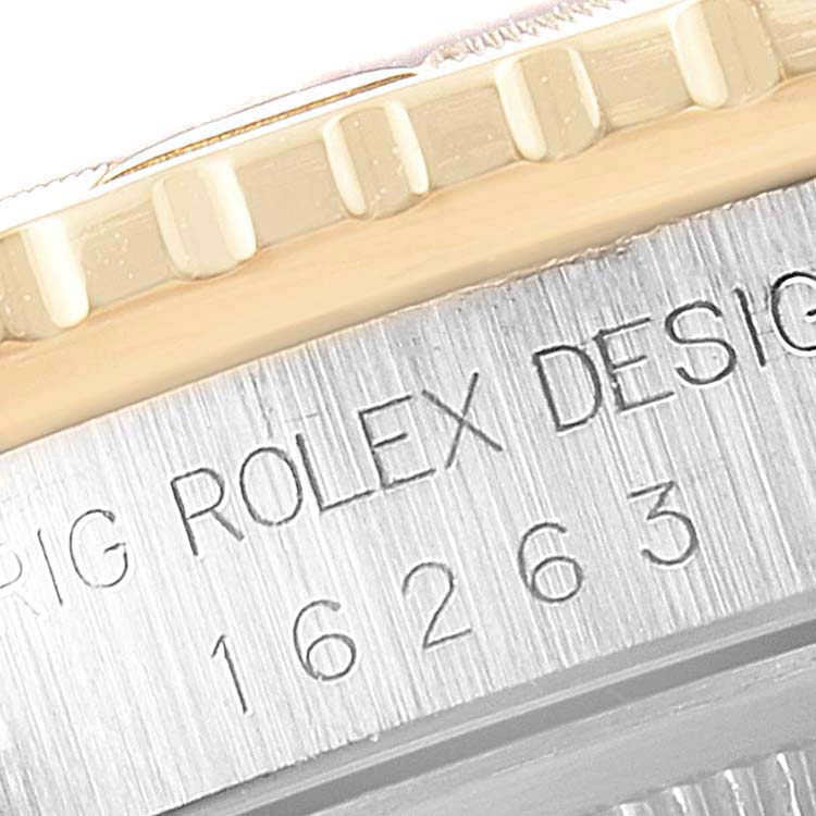 This close-up image of the Rolex Turn-o-Graph 16263 Men
s Steel and Gold (two tone) White Dial 16263 Men
s Steel and Gold (two tone) White Dial model shows the engraved model number and part of the fluted bezel.