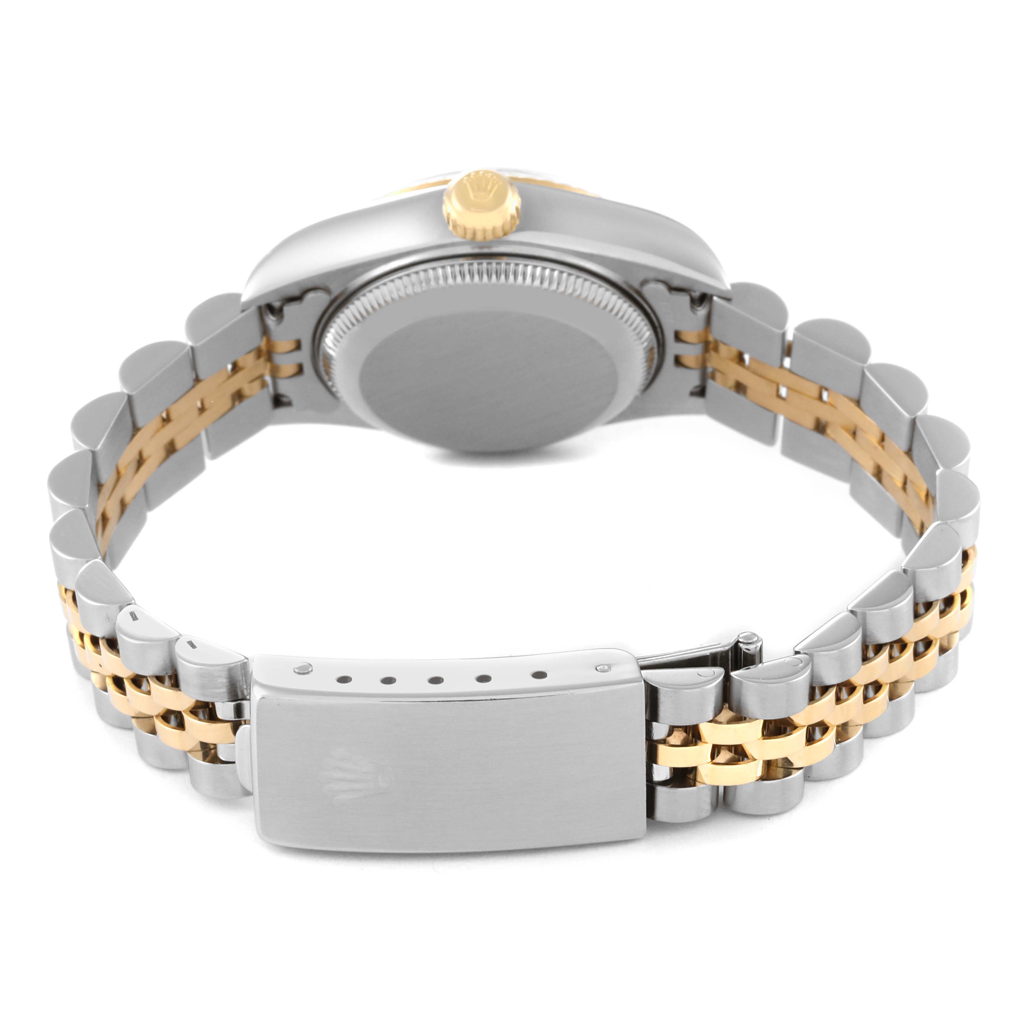 The image shows the back of the Rolex Datejust 79173 Women's Steel and Gold (two tone) White Dial 79173 Women's Steel and Gold (two tone) White Dial watch, featuring a two-tone bracelet and the crown on the side.