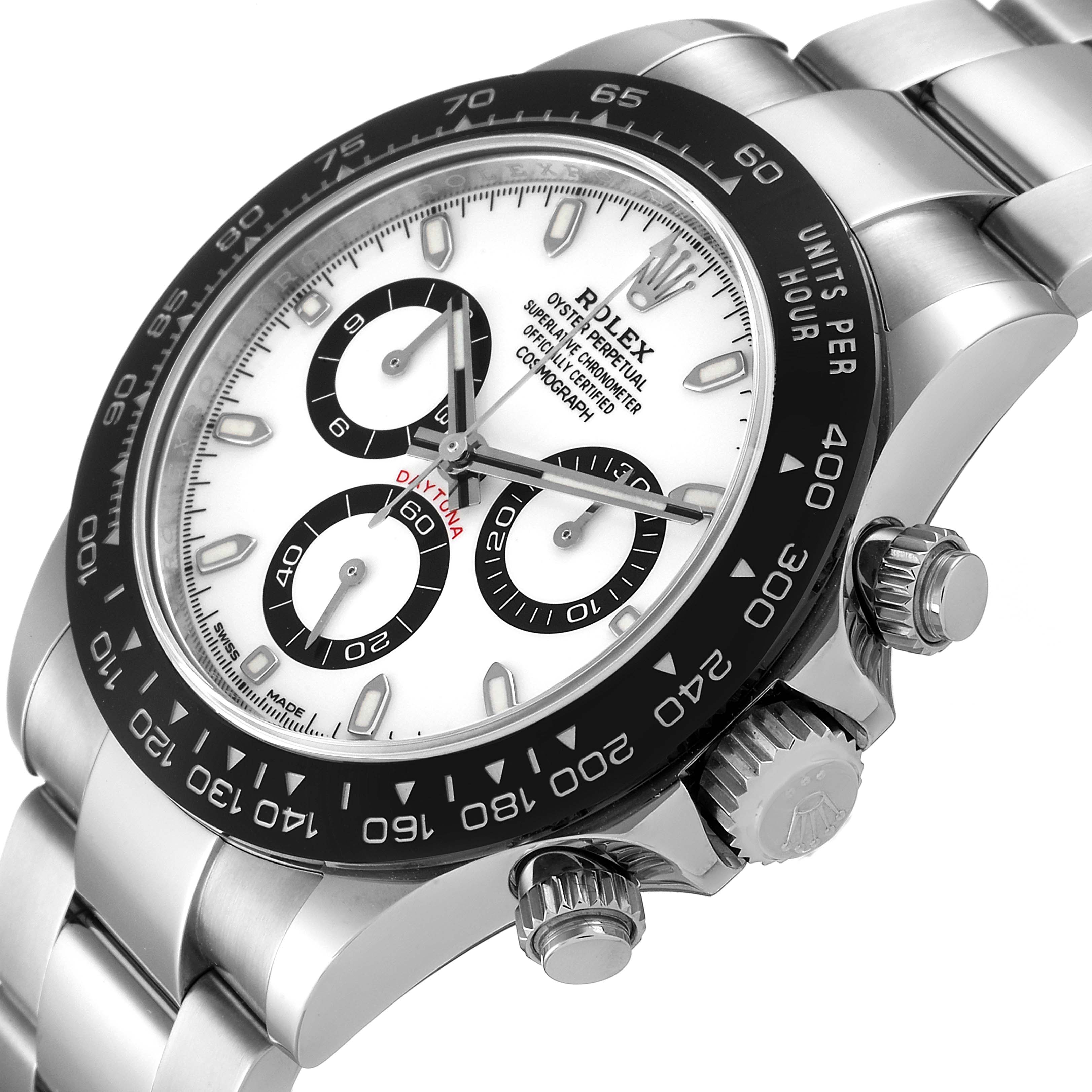The Rolex Daytona 116500 Men's Stainless Steel White Dial 116500 Men's Stainless Steel White Dial watch is shown at an angled close-up, highlighting its face, bezel, and crown.