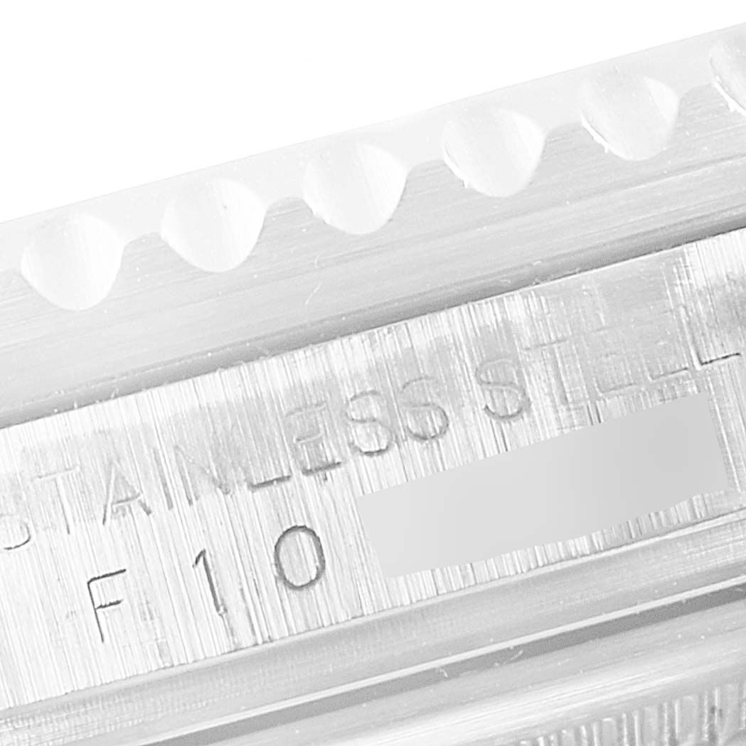 This close-up image shows part of the stainless steel casing and bezel teeth of the Rolex GMT-Master 16710 Men
s Stainless Steel Black Dial 16710 Men
s Stainless Steel Black Dial watch.