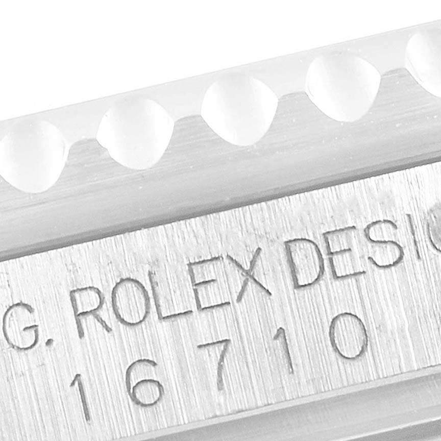 This close-up angle shows the engraved model number "16710" on the side of a Rolex GMT-Master 16710 Men
s Stainless Steel Black Dial 16710 Men
s Stainless Steel Black Dial watch
s case.