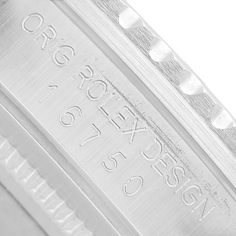 The image shows a close-up of the side of a Rolex GMT-Master 16750 Men's Stainless Steel Black Dial, highlighting the engraved model number and design details.
