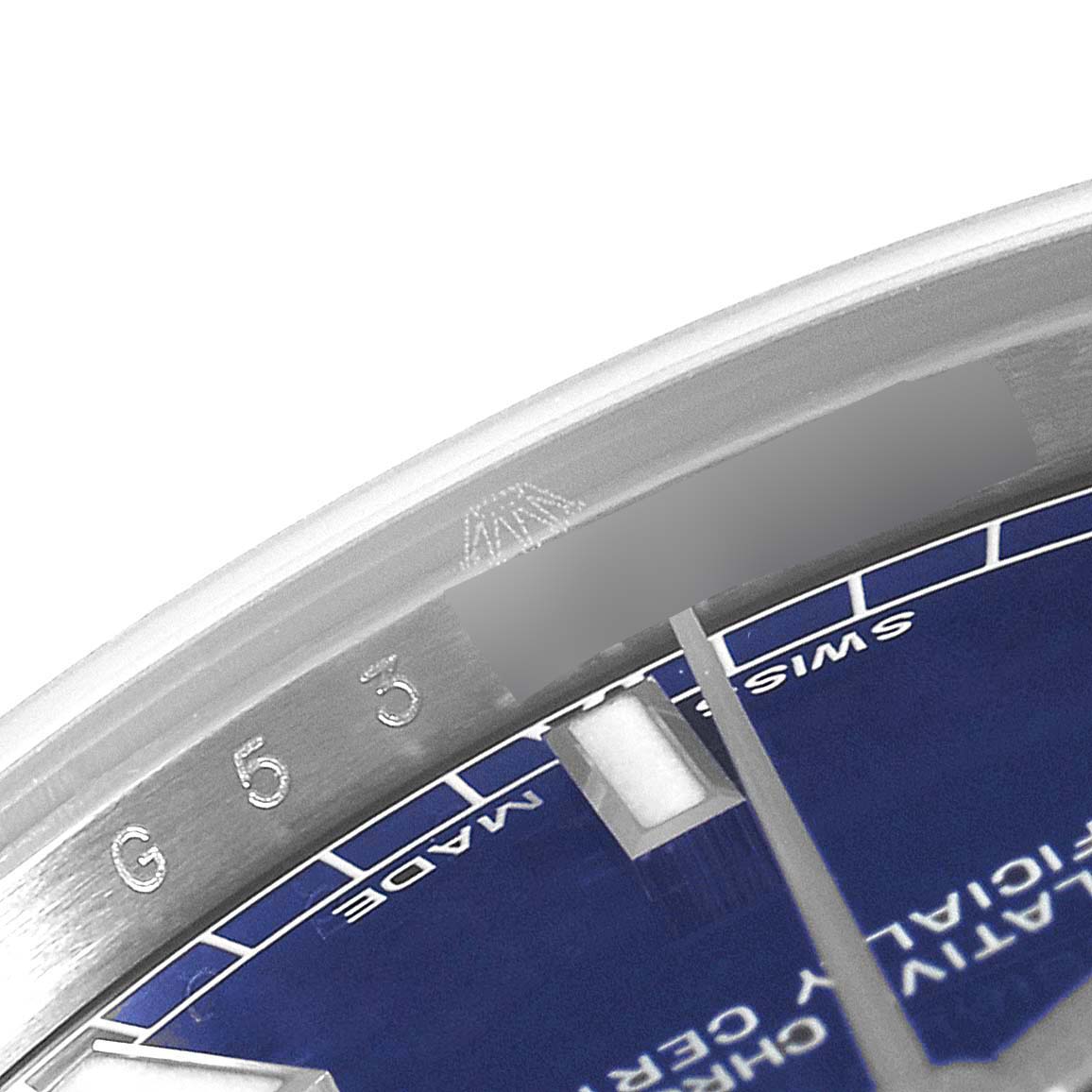 The image shows a close-up view of the bezel and part of the dial of a Rolex Mid-Size 178240 Women's Stainless Steel Blue Dial 178240 Women's Stainless Steel Blue Dial watch, highlighting the engraved serial number and markers.