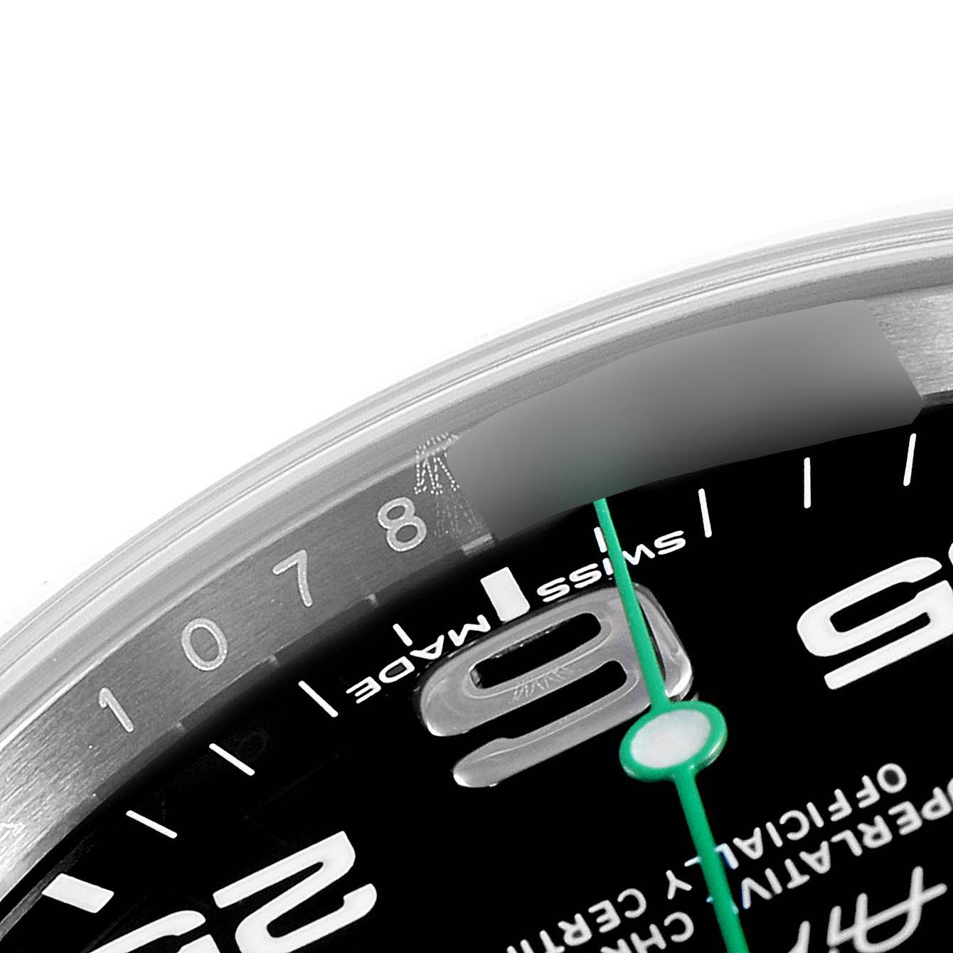 This close-up image of the Rolex Air-King 116900 Men's Stainless Steel Black Dial 116900 Men's Stainless Steel Black Dial watch shows a partial view of the dial and bezel, including the 8 and 9 numerals, and the second hand.