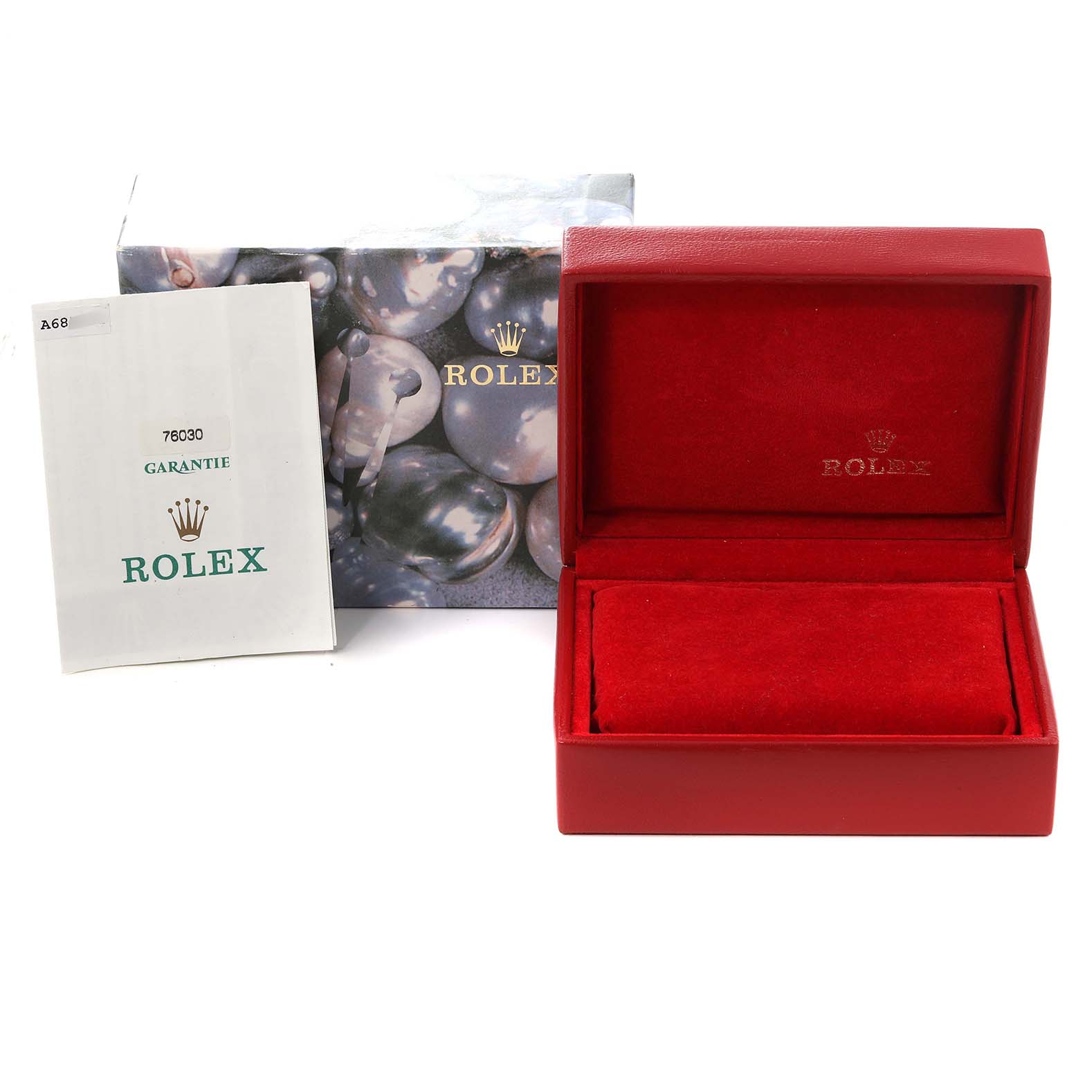 The image shows a Rolex Oyster Perpetual 76030 Women
s Stainless Steel Pink Dial 76030 Women
s Stainless Steel Pink Dial box, warranty booklet, and outer packaging from a front angle.