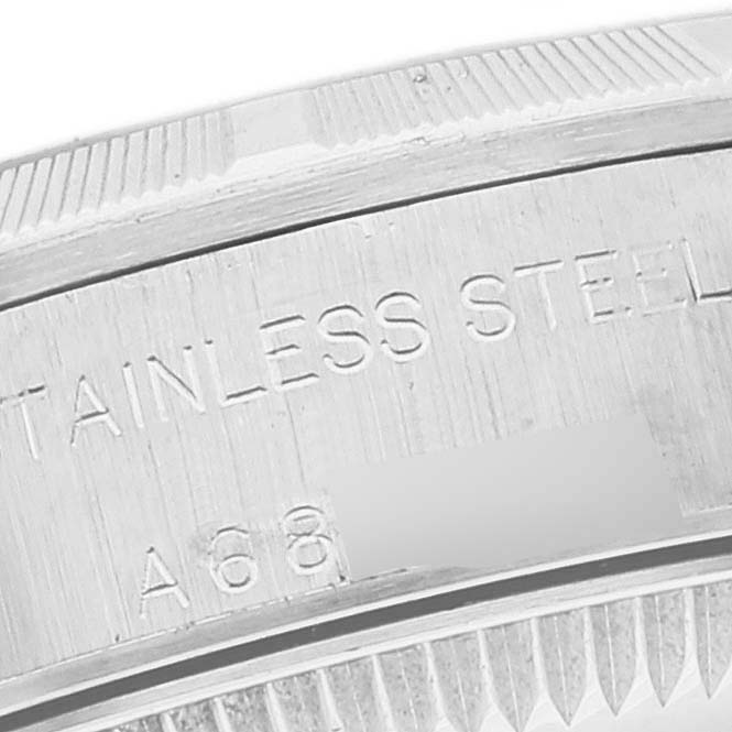 This image shows a close-up view of the engravings on the stainless steel back of a Rolex Oyster Perpetual 76030 Women
s Stainless Steel Pink Dial 76030 Women
s Stainless Steel Pink Dial watch.