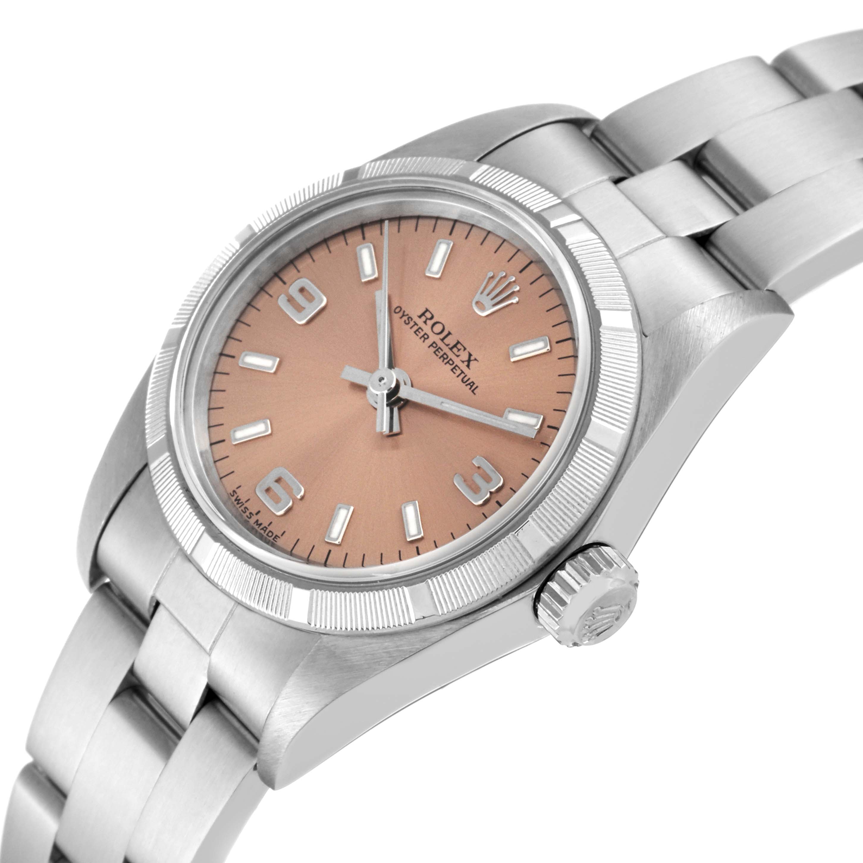 This image shows a close-up angled view of the Rolex Oyster Perpetual 76030 Women
s Stainless Steel Pink Dial 76030 Women
s Stainless Steel Pink Dial watch, highlighting the dial, bezel, crown, and part of the bracelet.