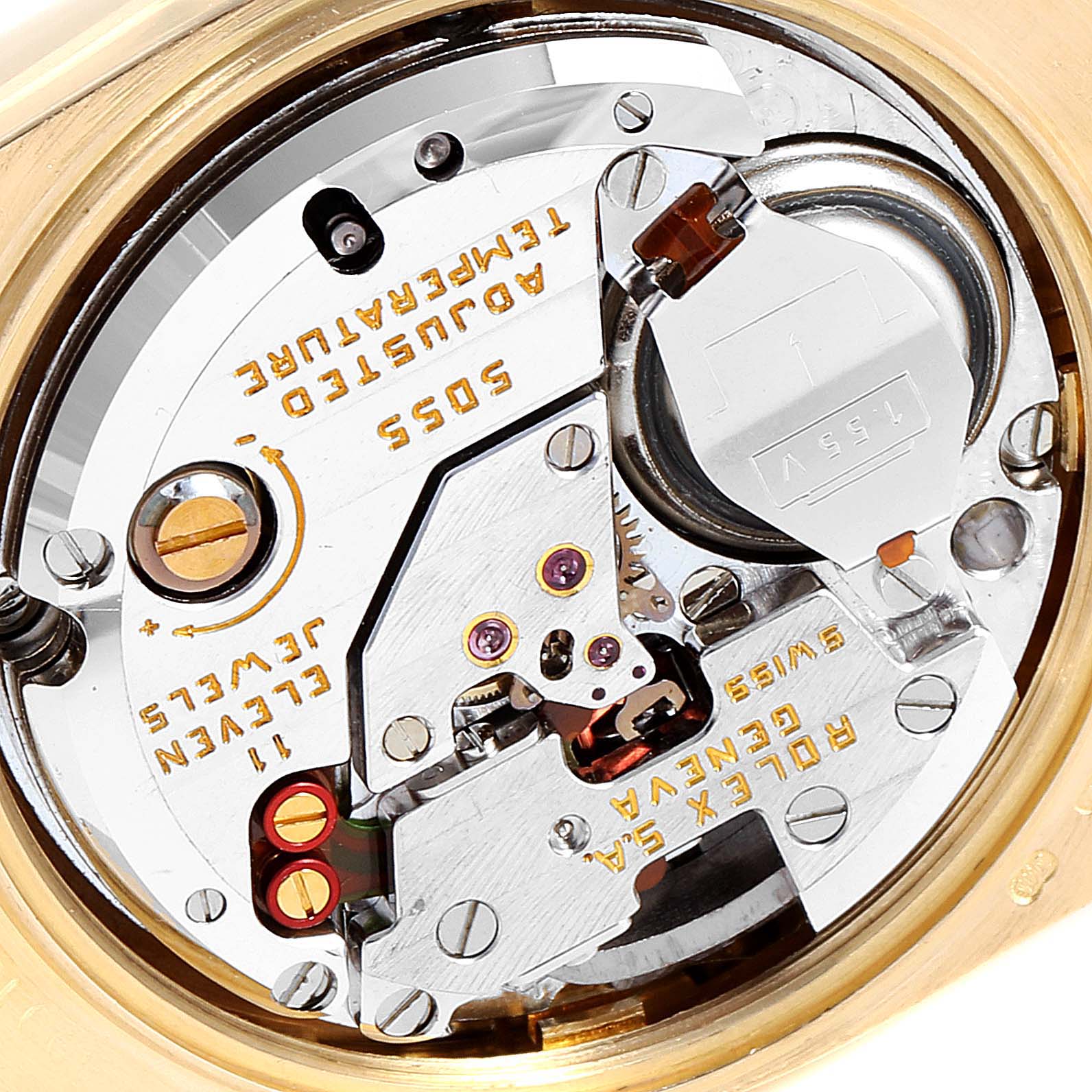 This is a close-up view of the movement inside a Rolex Oysterquartz 19018 Men's Yellow Gold Champagne Dial 19018 Men's Yellow Gold Champagne Dial watch, showing intricate gears and electronic components.