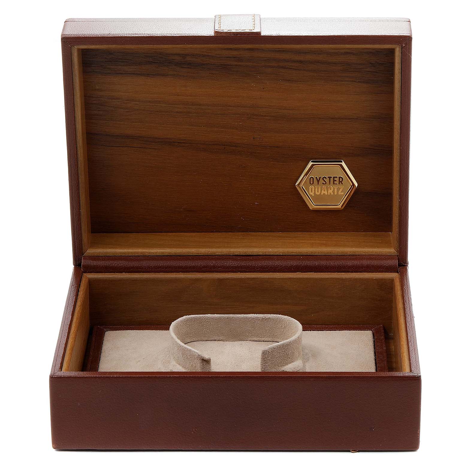 This is an open Rolex Oysterquartz 19018 Men's Yellow Gold Champagne Dial 19018 Men's Yellow Gold Champagne Dial watch box, showcasing its wooden interior and a cushion for the watch.