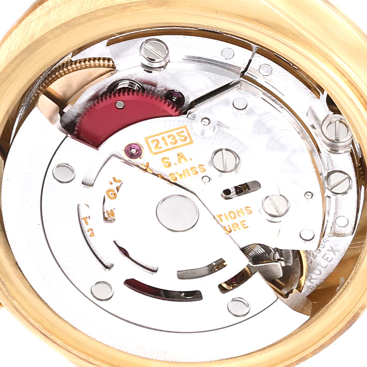 This image shows the intricate internal mechanism of the Rolex President 69178 Women
s Yellow Gold Beige Dial 69178 Women
s Yellow Gold Beige Dial watch, focusing on its movement components.