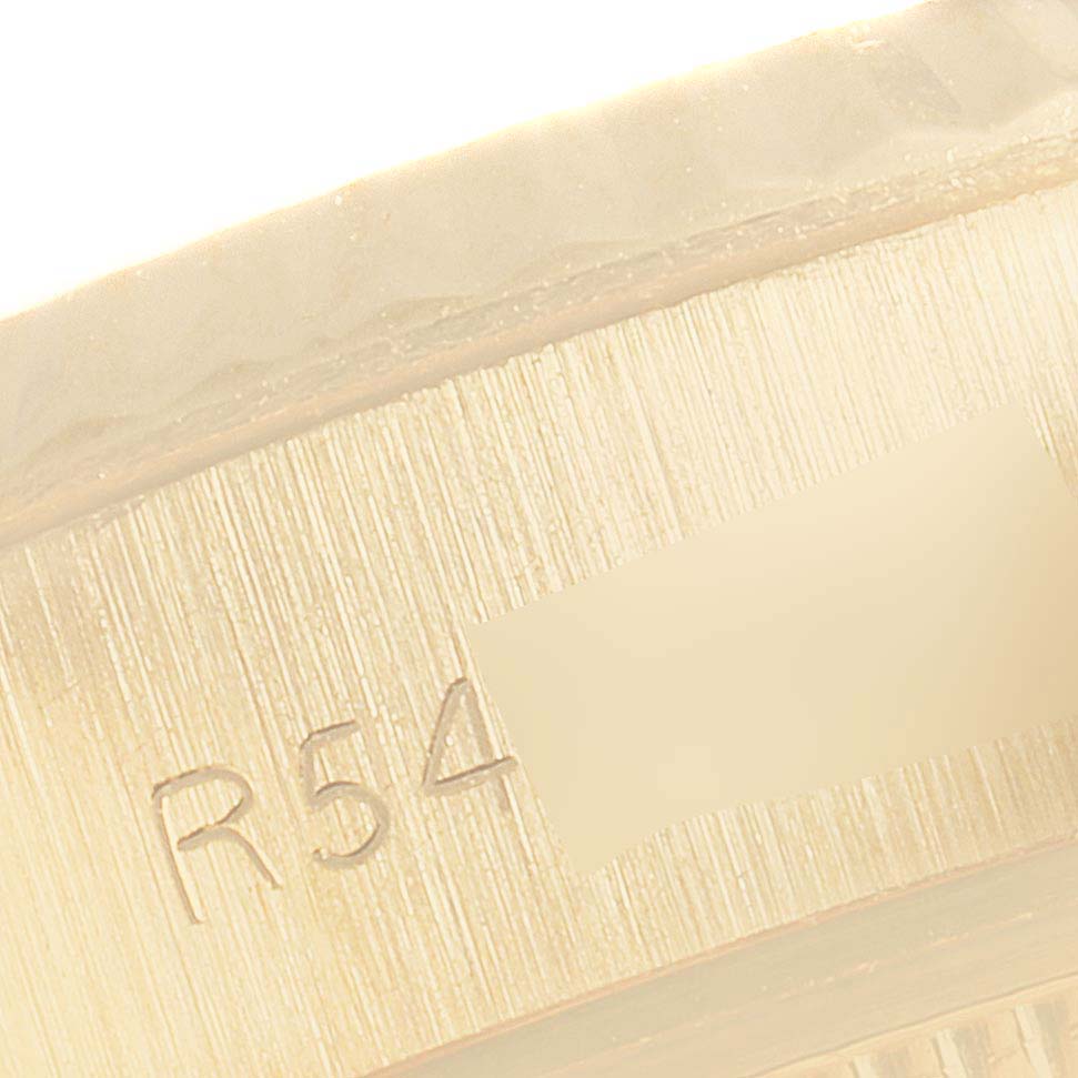 The image shows a close-up of the inner bracelet link of a Rolex President 69178 Women
s Yellow Gold Champagne Dial 69178 Women
s Yellow Gold Champagne Dial model watch, highlighting engravings and texture.