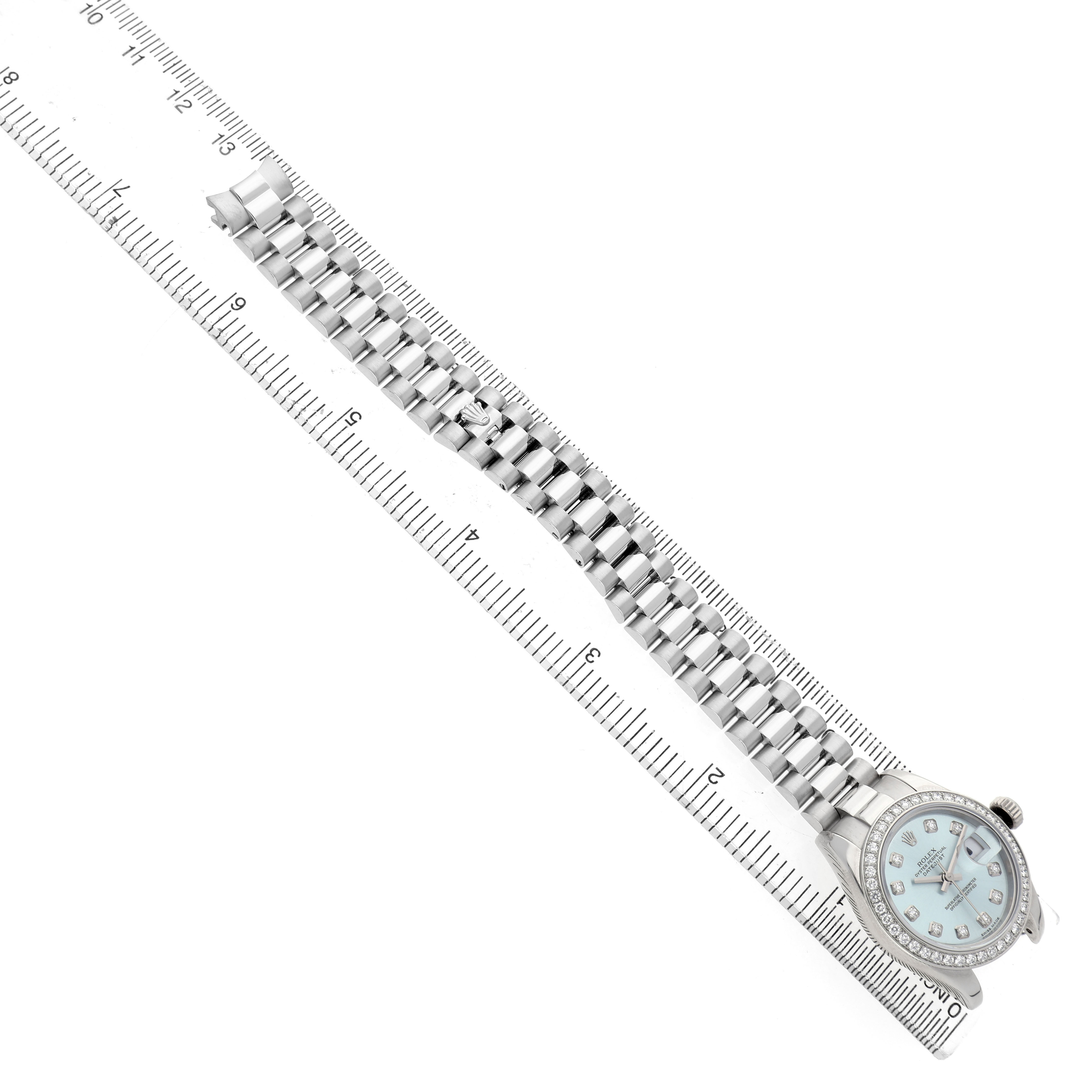 The Rolex President 179136 Women's Platinum Blue Dial watch is shown from a top-down angle with a full view of the bracelet and dial.