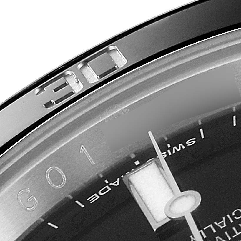 This close-up image of a Rolex Submariner 116610 Men
s Stainless Steel Black Dial 116610 Men
s Stainless Steel Black Dial watch shows the bezel and a part of the dial, including the hour marker and second hand.