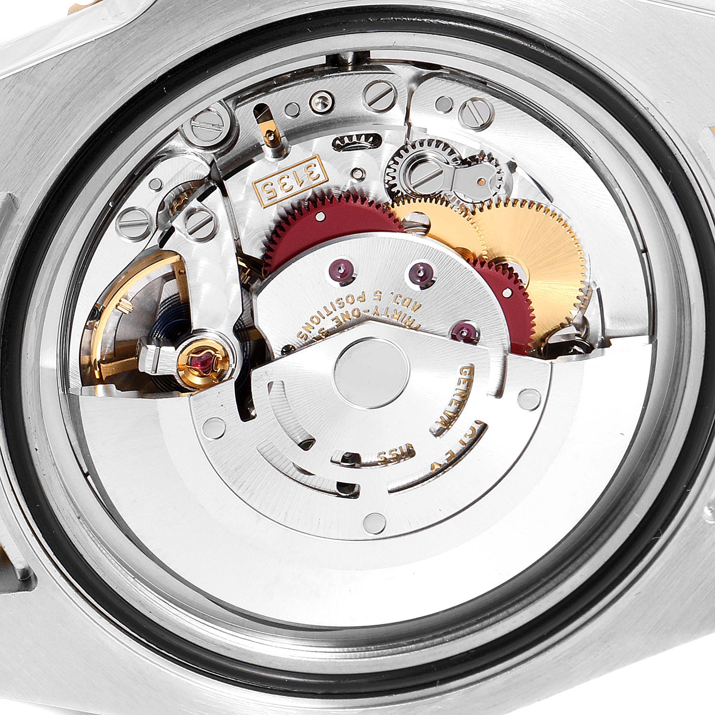 This image shows the intricate inner mechanical movement of a Rolex Submariner 116613 Men's Steel and Gold (two tone) Blue Dial 116613 Men's Steel and Gold (two tone) Blue Dial watch from a rear angle with the case back removed.