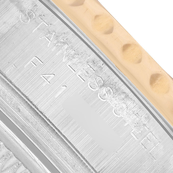 The image shows a close-up of the side view of a Rolex Yacht-Master 169623 Women's Steel and Gold (two tone) Grey Dial watch bezel and engraved text.