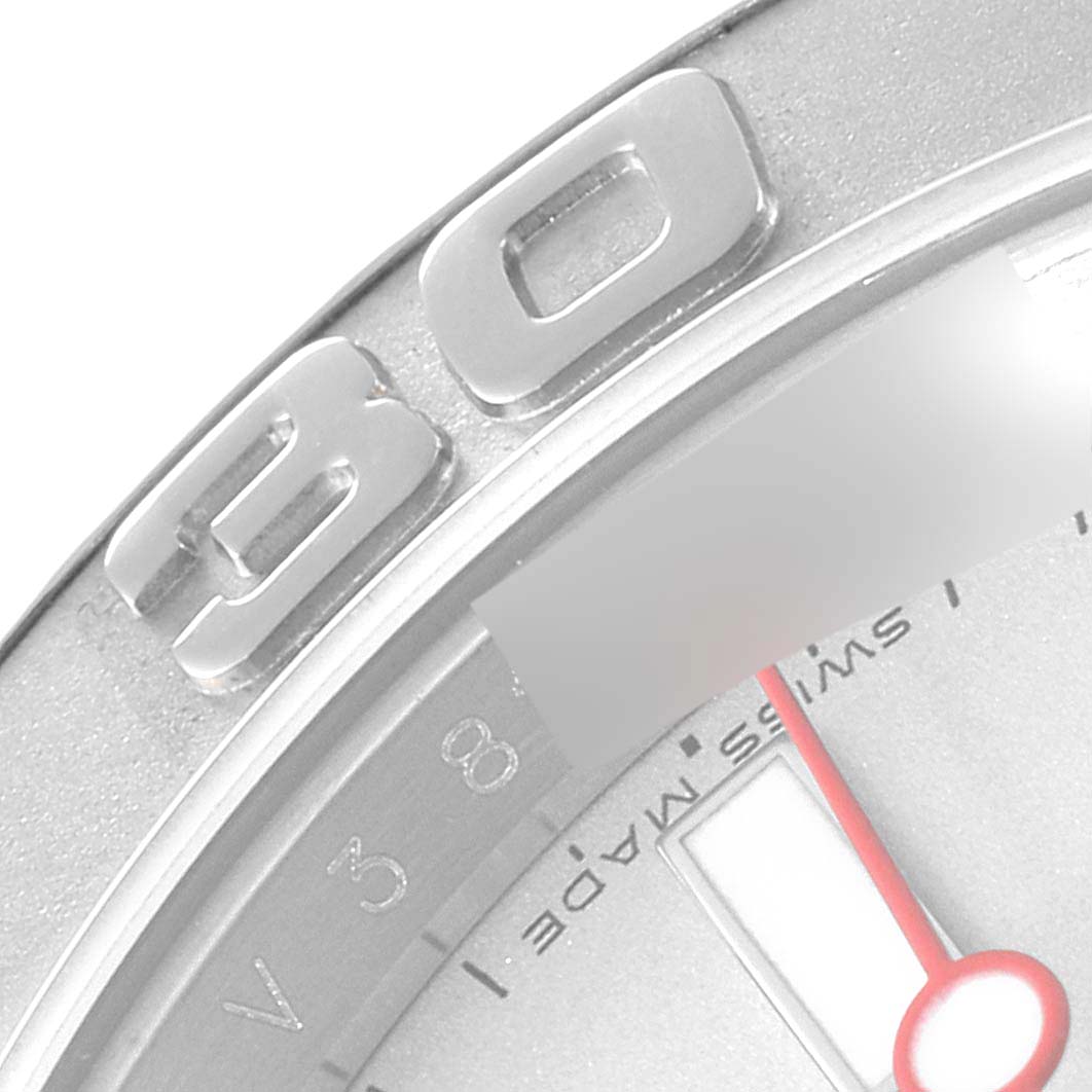 This close-up image of the Rolex Yacht-Master 16622 Men's Stainless Steel Silver Dial 16622 Men's Stainless Steel Silver Dial watch shows the "30" mark on the bezel and a portion of the dial with the "Swiss Made" imprint.