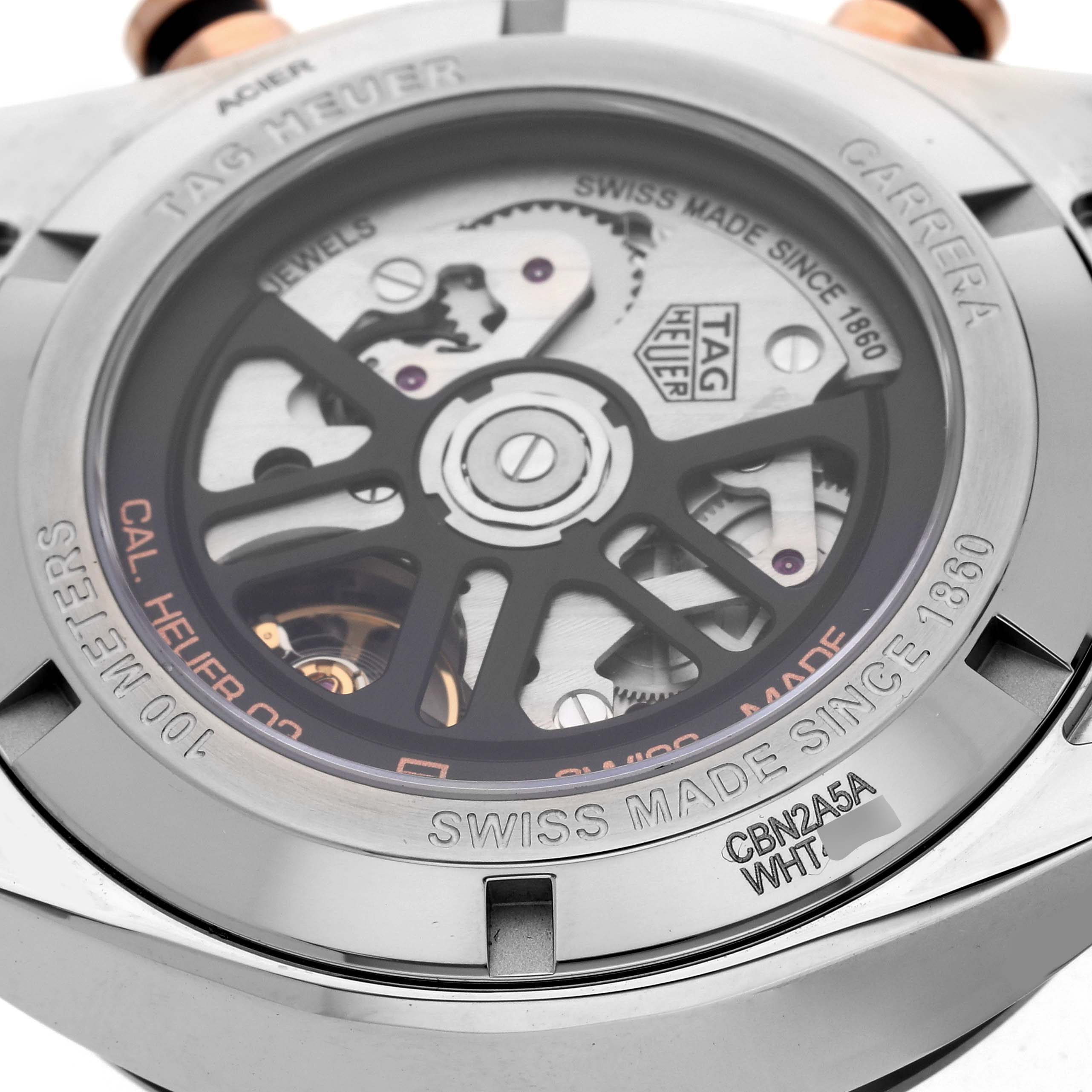The image shows the back case of a Tag Heuer Carrera CBN2A5A.FC6481 Men's Stainless Steel Black Dial CBN2A5A.FC6481 Men's Stainless Steel Black Dial watch, highlighting its inner mechanics and engravings.