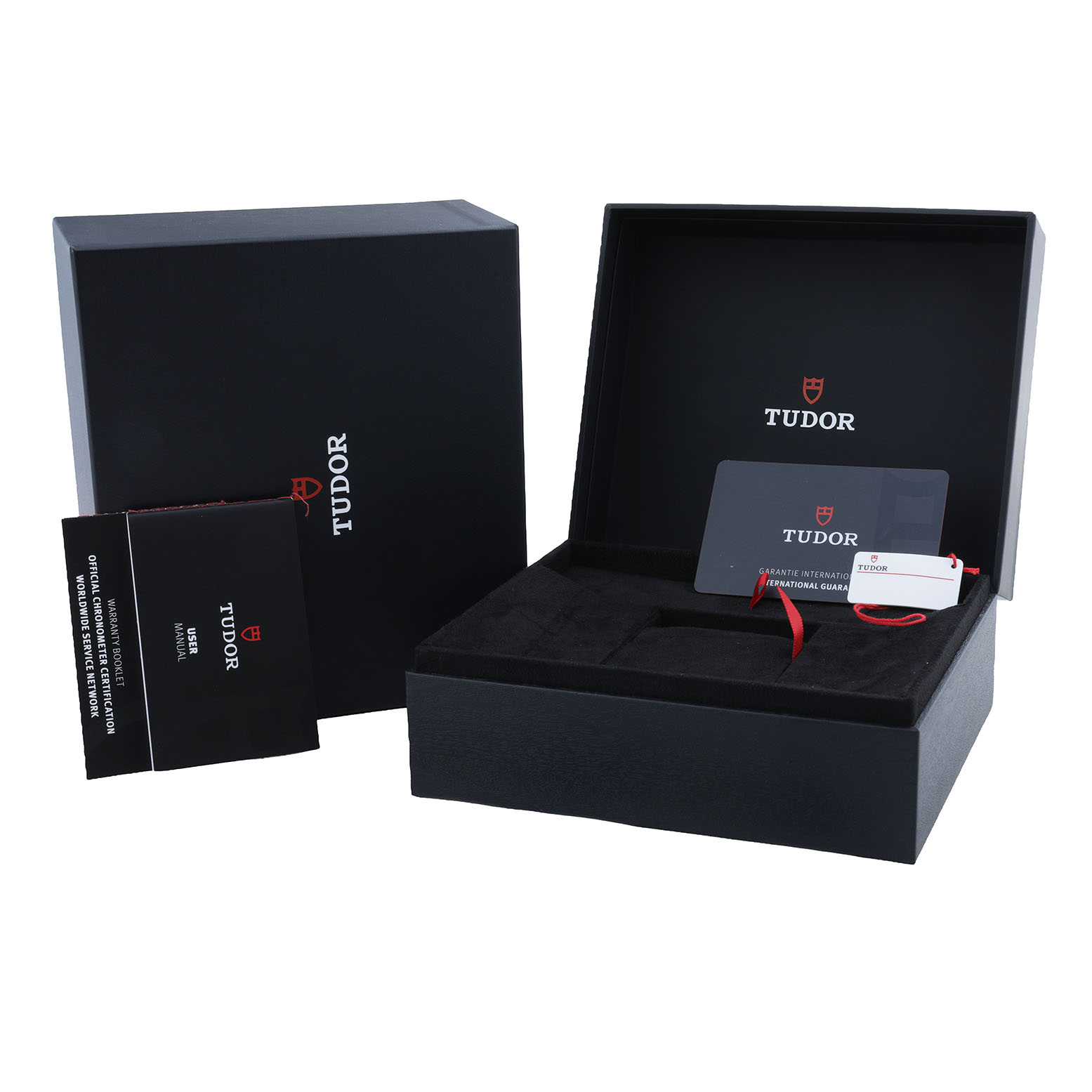 The image shows the Tudor Heritage Black Bay M79310N-0001 Men's Stainless Steel Yellow Dial watch box, user manual, guarantee card, and tags, viewed from the front.