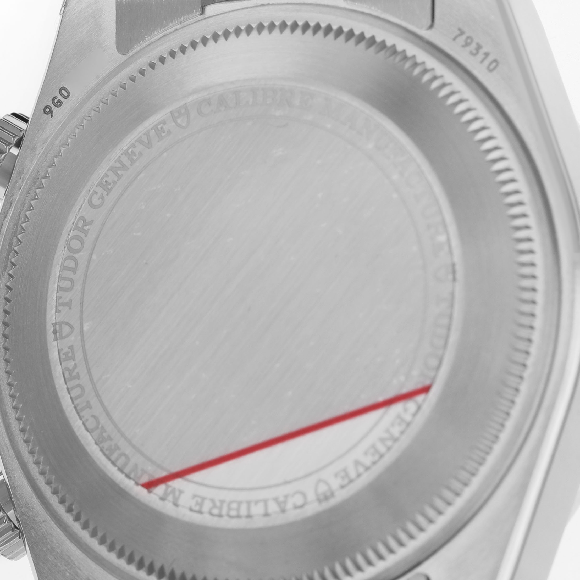 The image shows the back casing of a Tudor Heritage Black Bay M79310N-0001 Men's Stainless Steel Yellow Dial watch, highlighting the engraved details and case design.