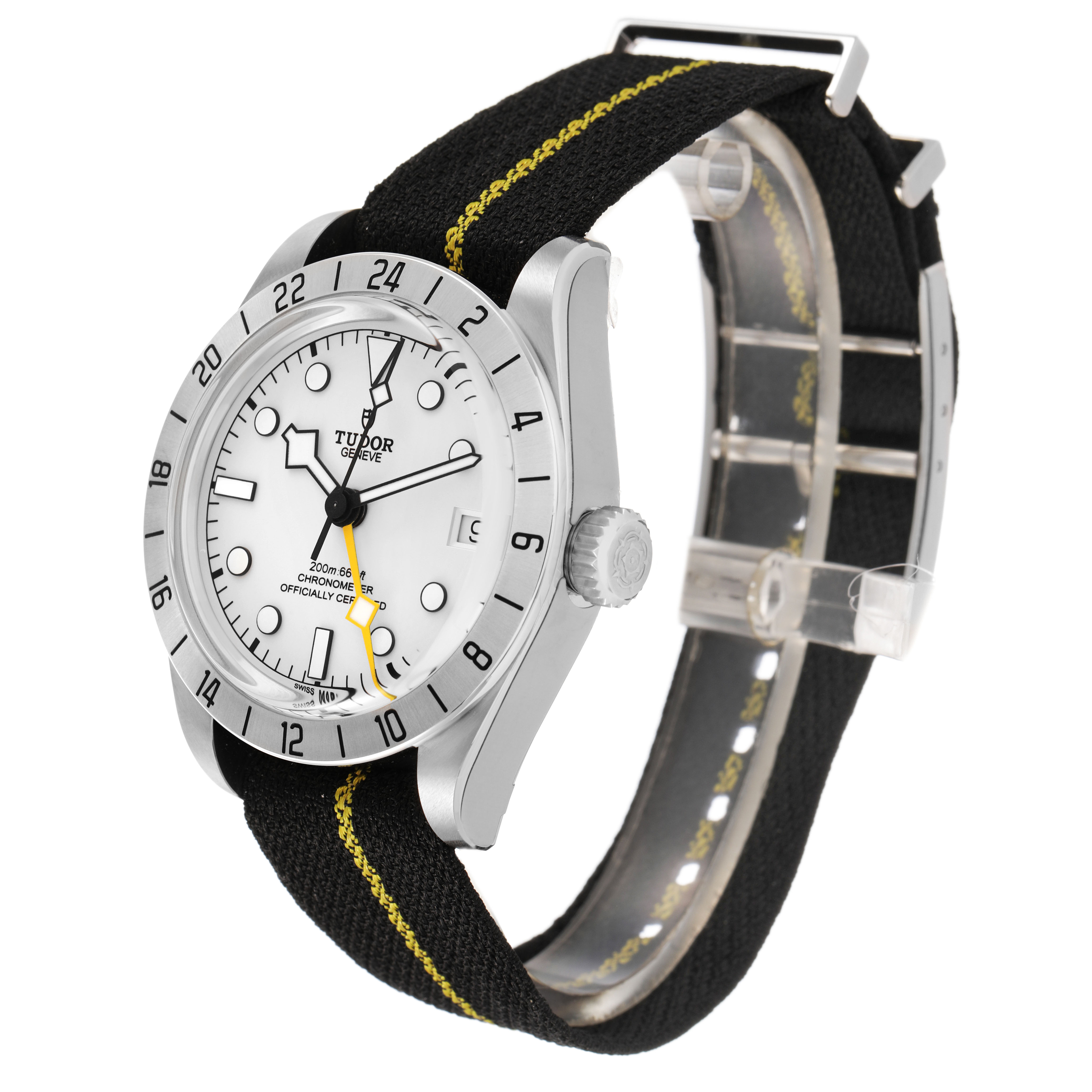 The Tudor Heritage Black Bay 79470 Men's Stainless Steel Black Dial watch is shown at a three-quarter angle, highlighting the face, bezel, crown, and strap.