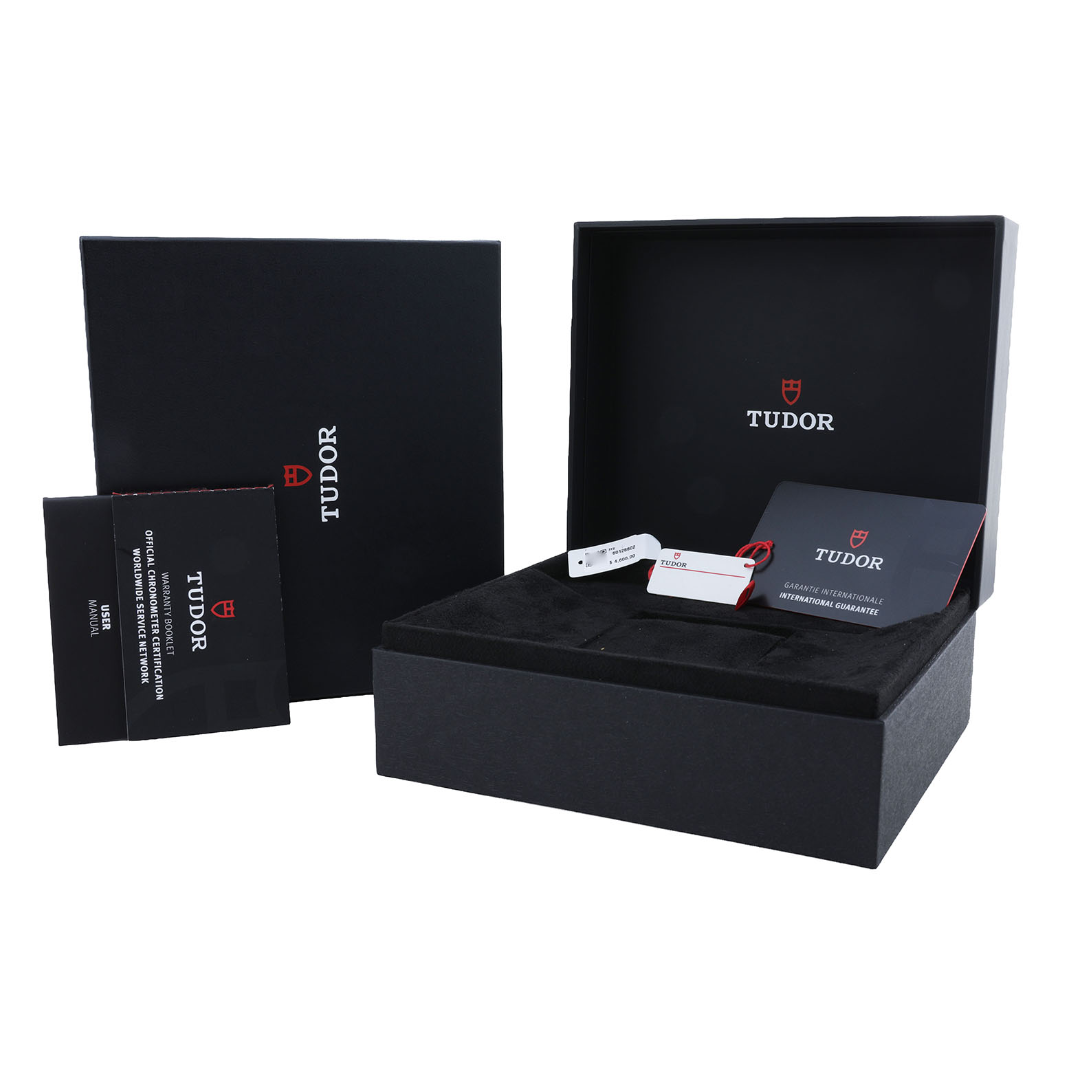 The image shows the open box and packaging for the Tudor Heritage Black Bay 79470 Men's Stainless Steel Black Dial, including manuals and tags.