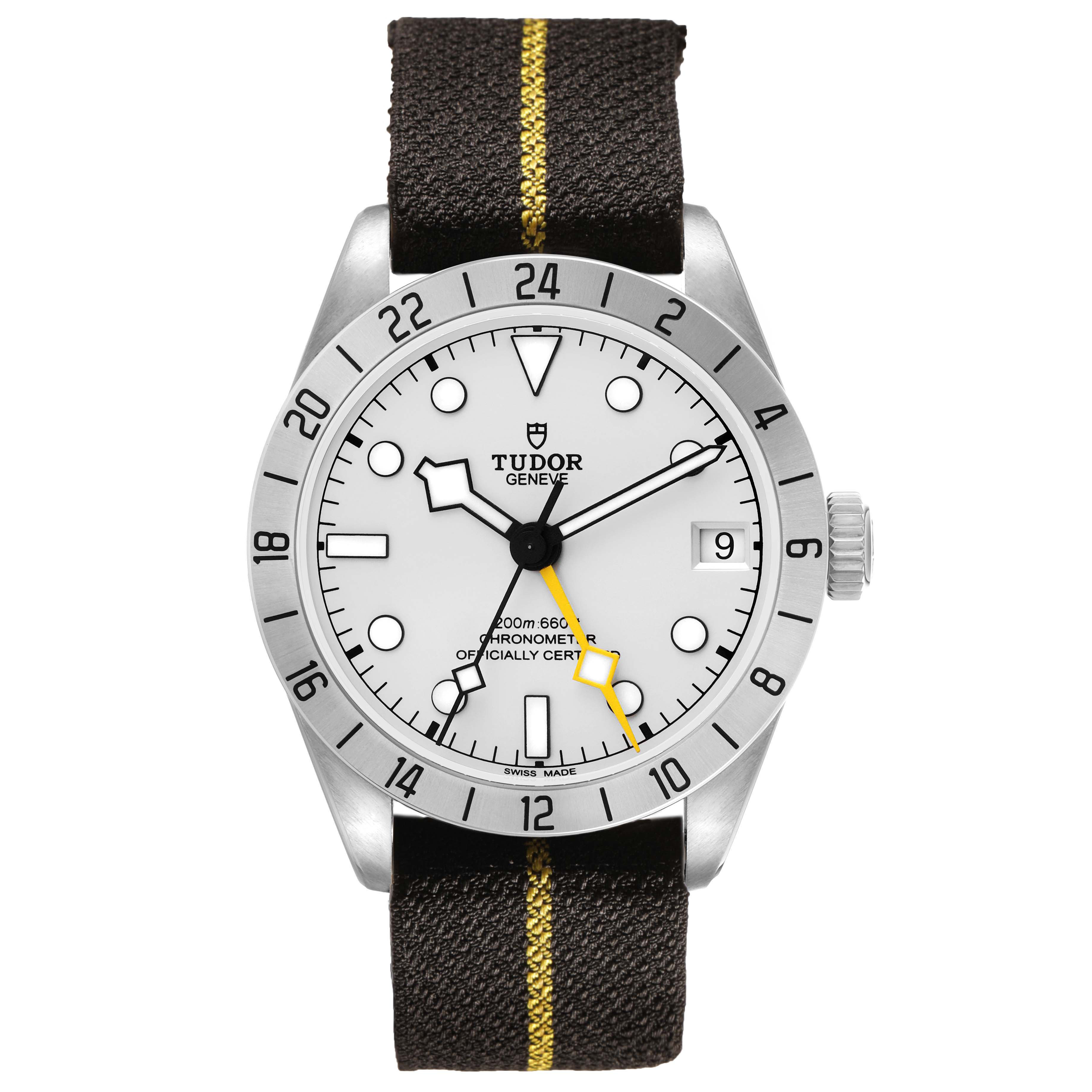 The Tudor Heritage Black Bay 79470 Men's Stainless Steel Black Dial watch is shown from the front, displaying its face, bezel, crown, and strap.