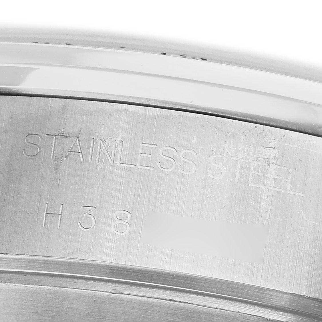 The image shows a close-up of the stainless steel case back of a Tudor Prince 79280 Men's Stainless Steel Pink Dial watch.