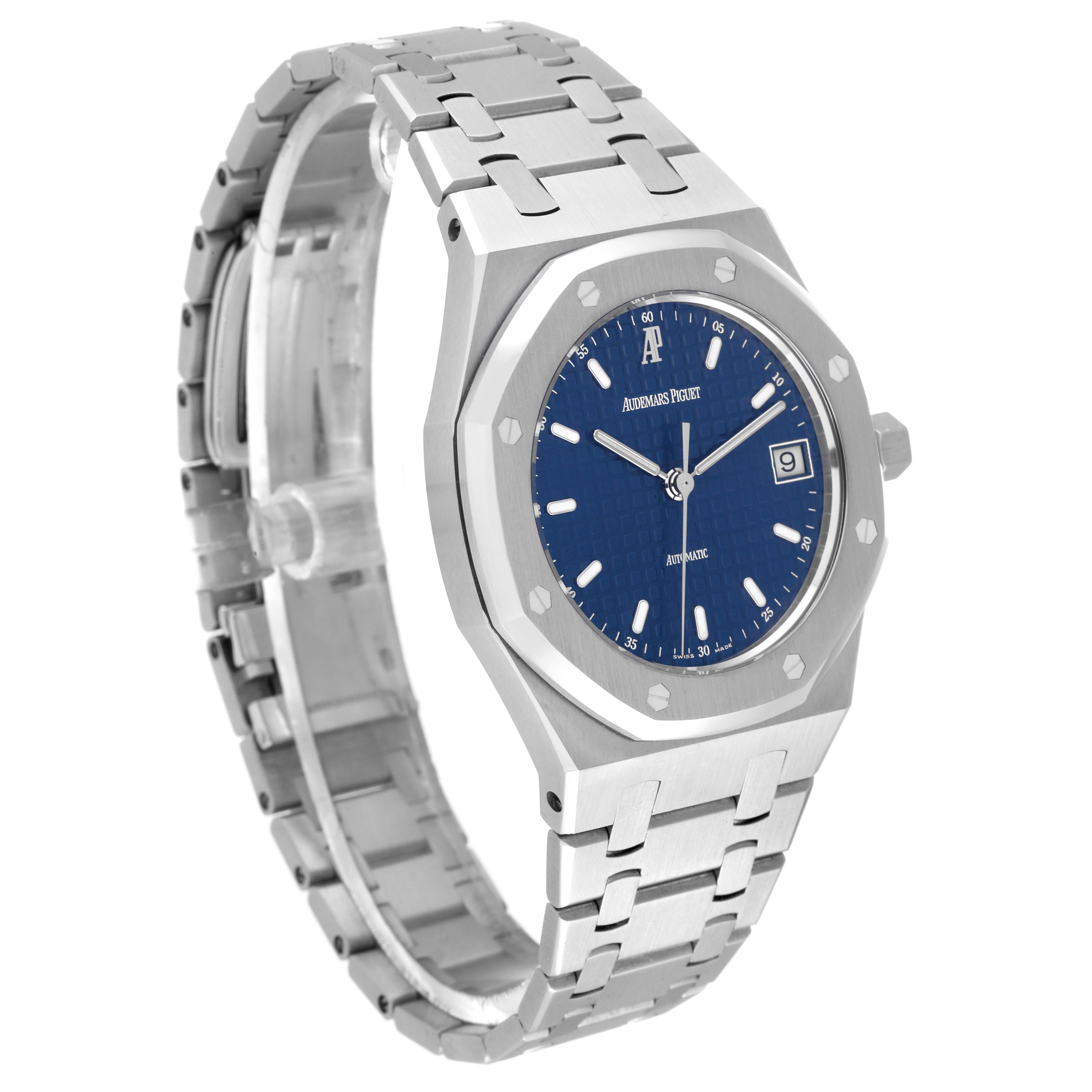 The image shows a side angle of the Audemars Piguet Royal Oak 14790ST.OO.0789ST.08 Men's Stainless Steel Blue Dial 14790ST.OO.0789ST.08 Men's Stainless Steel Blue Dial watch, featuring its octagonal bezel, blue dial, and metal bracelet.