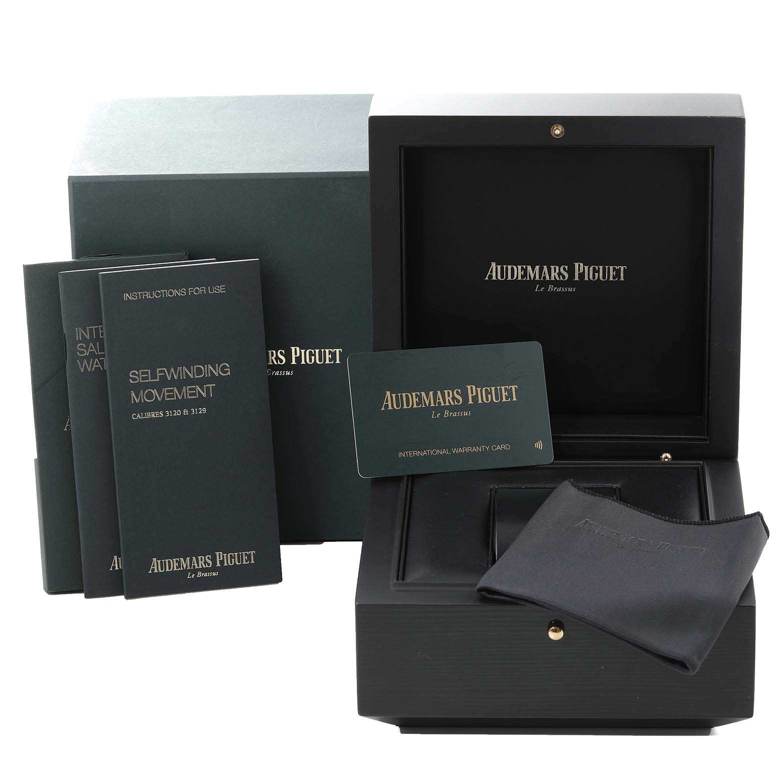 The image shows an Audemars Piguet Royal Oak 15450SR.OO.1256SR.01 Men's Steel and Gold (two tone) Silver Dial 15450SR.OO.1256SR.01 Men's Steel and Gold (two tone) Silver Dial watch box, warranty card, manuals, and a polishing cloth from a front angle.