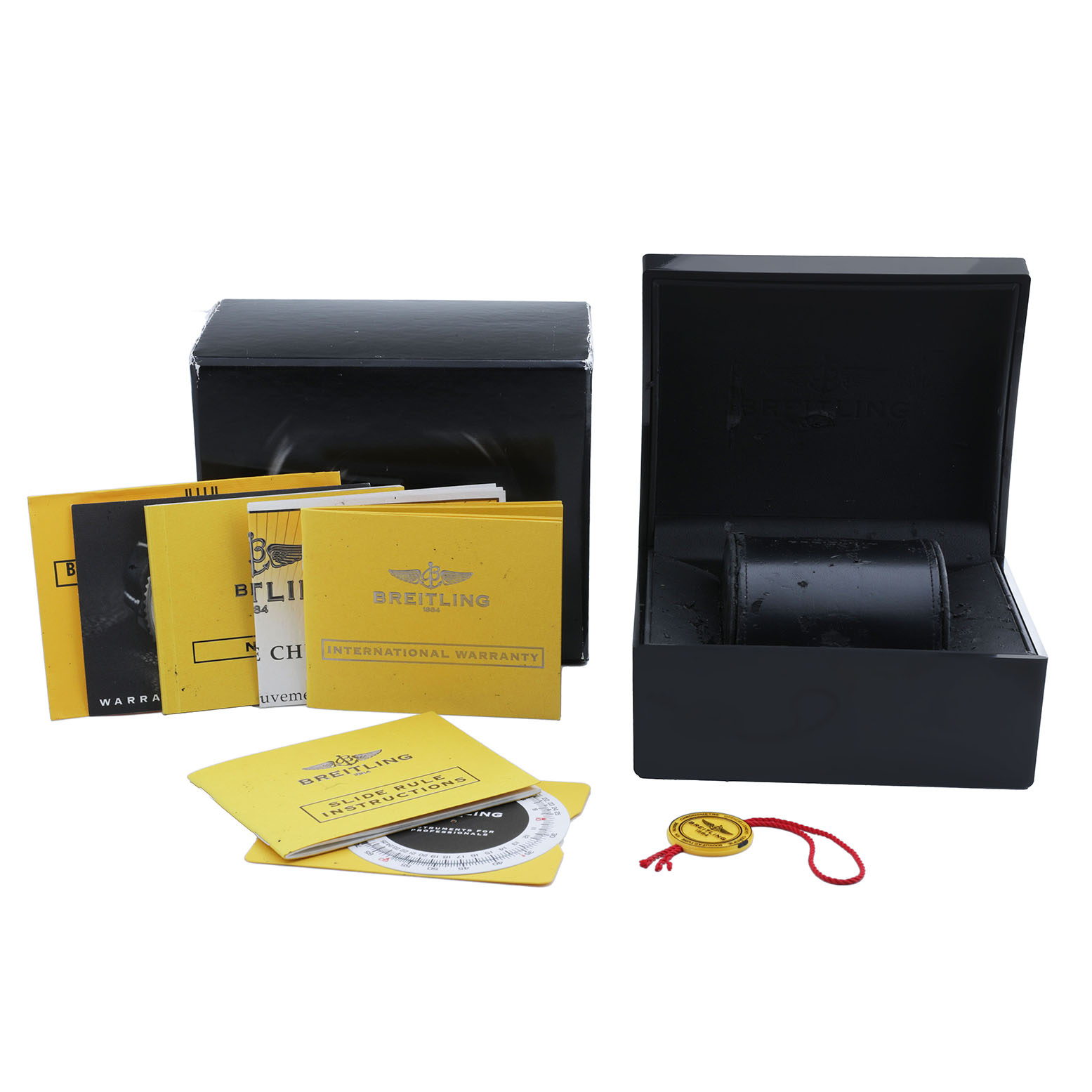The image shows a Breitling Navitimer A23322 Men's Stainless Steel Silver Dial watch box, manuals, warranty cards, and a tag, all taken from a frontal angle.