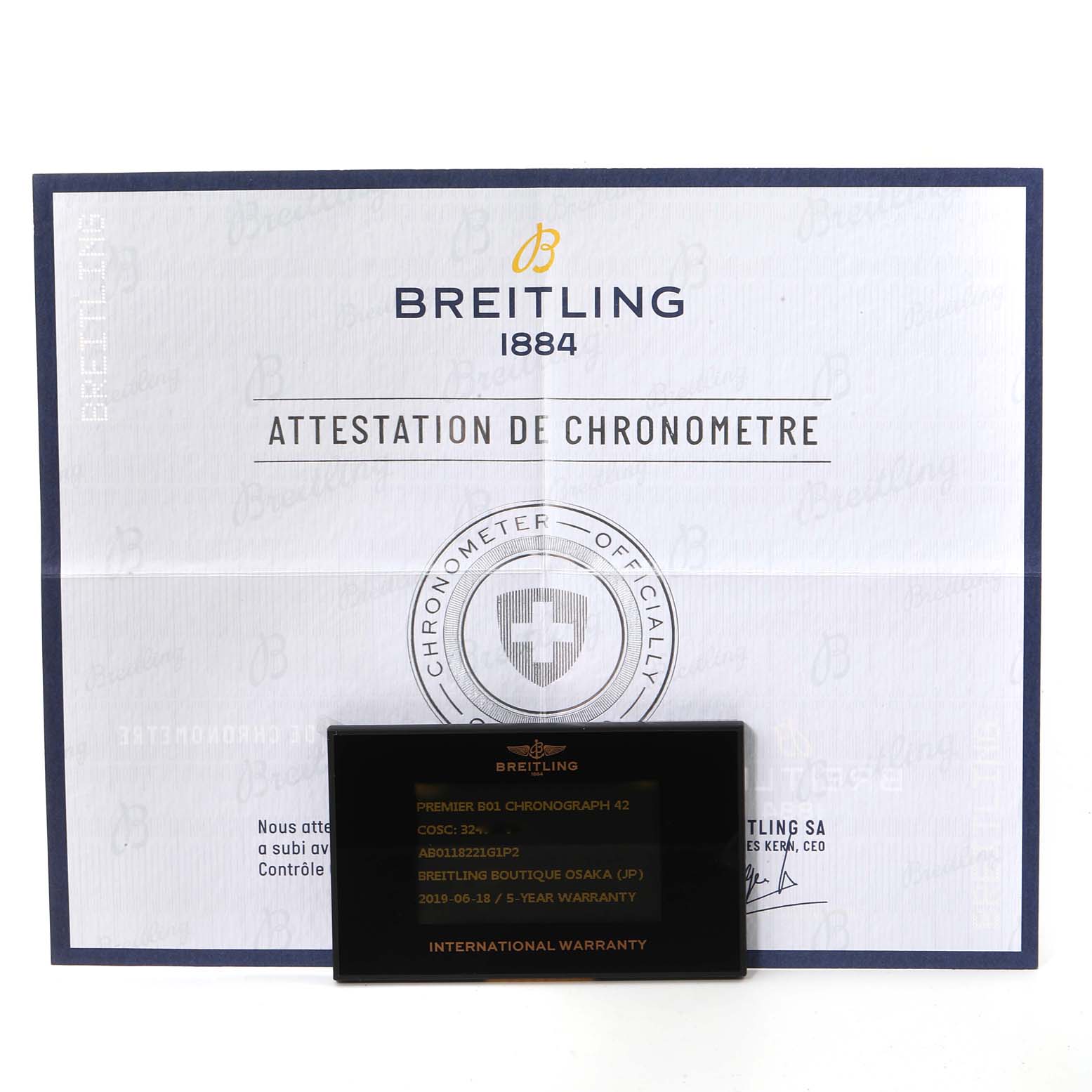 The image shows a Breitling Premier AB011822/G843-1018PT Men's Stainless Steel Silver Dial AB011822/G843-1018PT Men's Stainless Steel Silver Dial model's Chronometer Certification document and an International Warranty card.