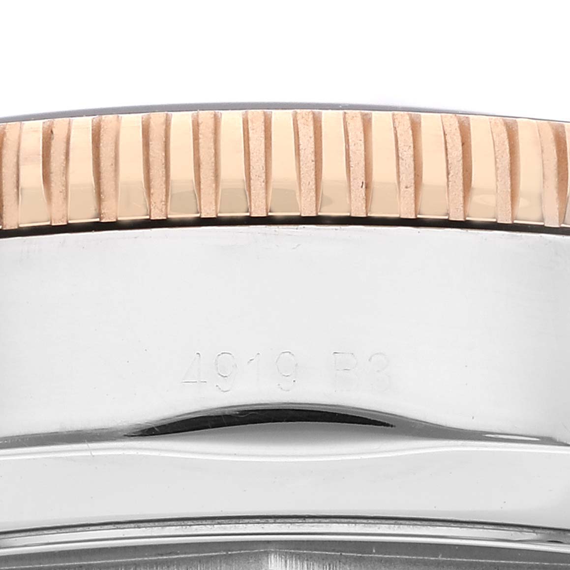 This image shows a close-up of the side of the bezel and case of the Breitling Superocean UB2030121B1A1 Men's Steel and Gold (two tone) Black Dial UB2030121B1A1 Men's Steel and Gold (two tone) Black Dial watch.