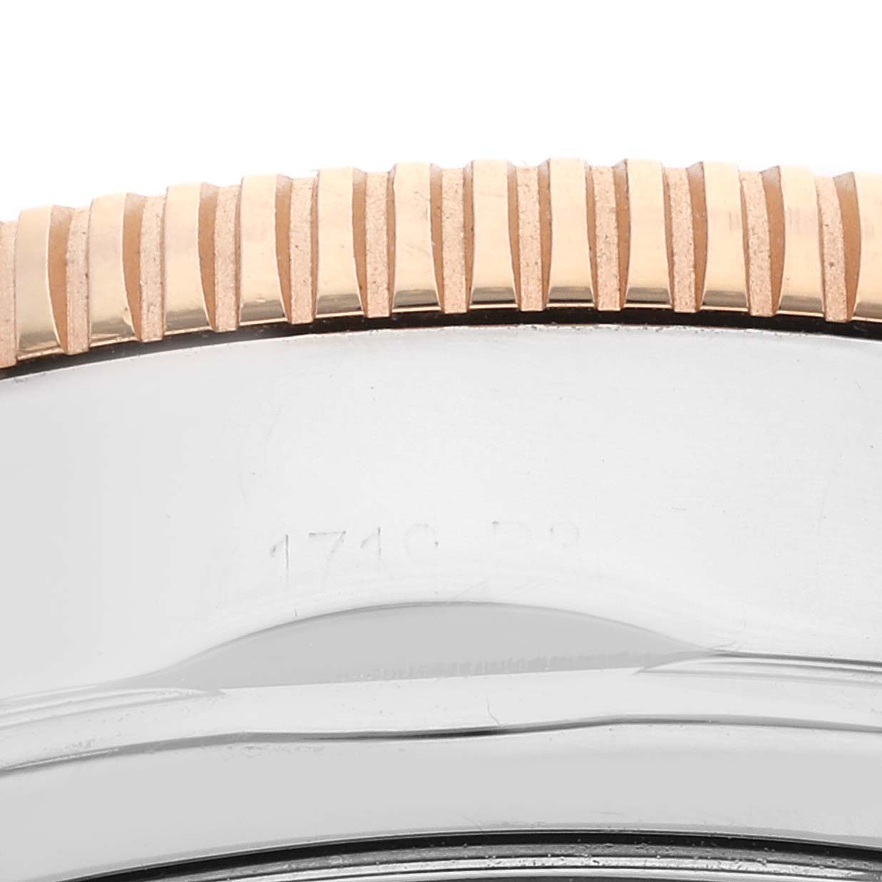 This close-up image shows the side view of the bezel and case of a Breitling Superocean U1331312/BG50/279S/A20D.4 Men's Steel and Gold (two tone) Black Dial U1331312/BG50/279S/A20D.4 Men's Steel and Gold (two tone) Black Dial watch.