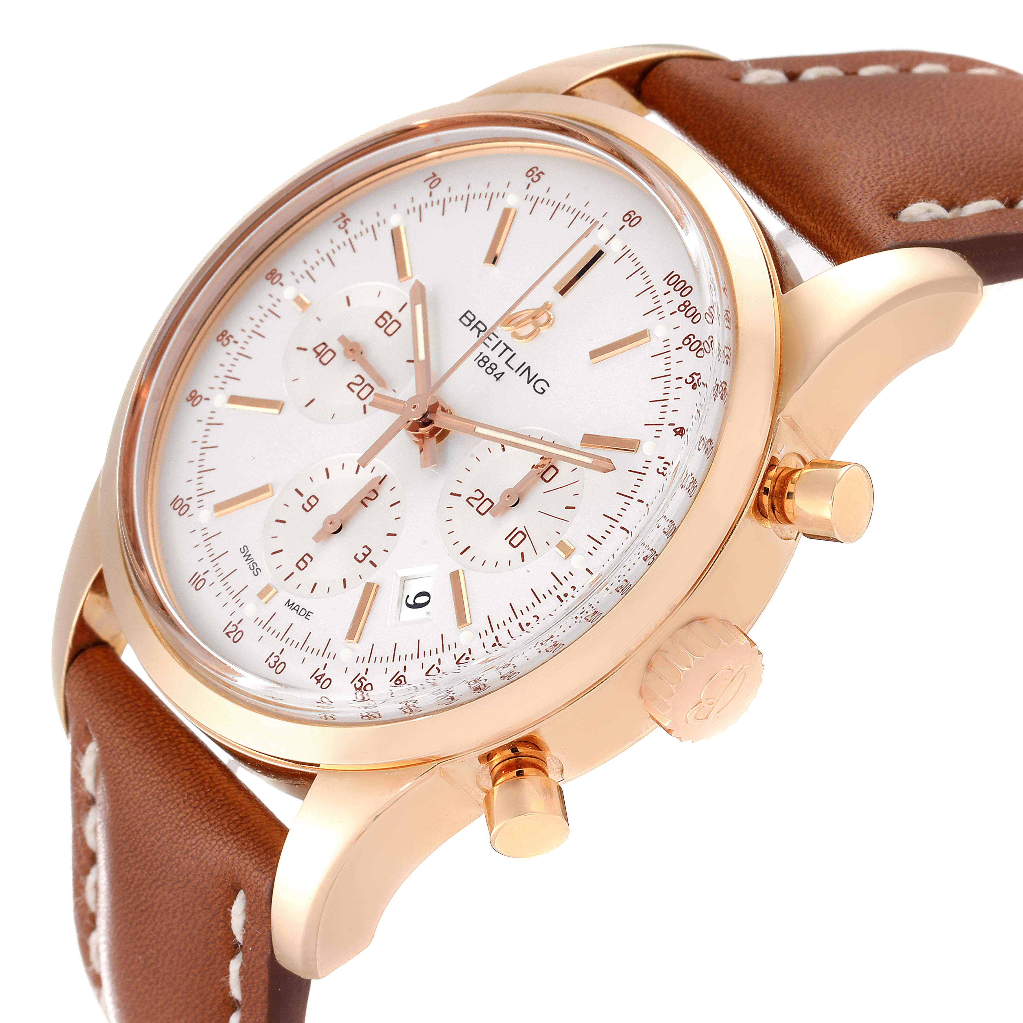 The image shows a close-up of the Breitling Transocean RB0152 Men's Rose Gold Silver Dial RB0152 Men's Rose Gold Silver Dial watch with a brown leather strap, focusing on the dial, bezel, and chronograph pushers from a side angle.