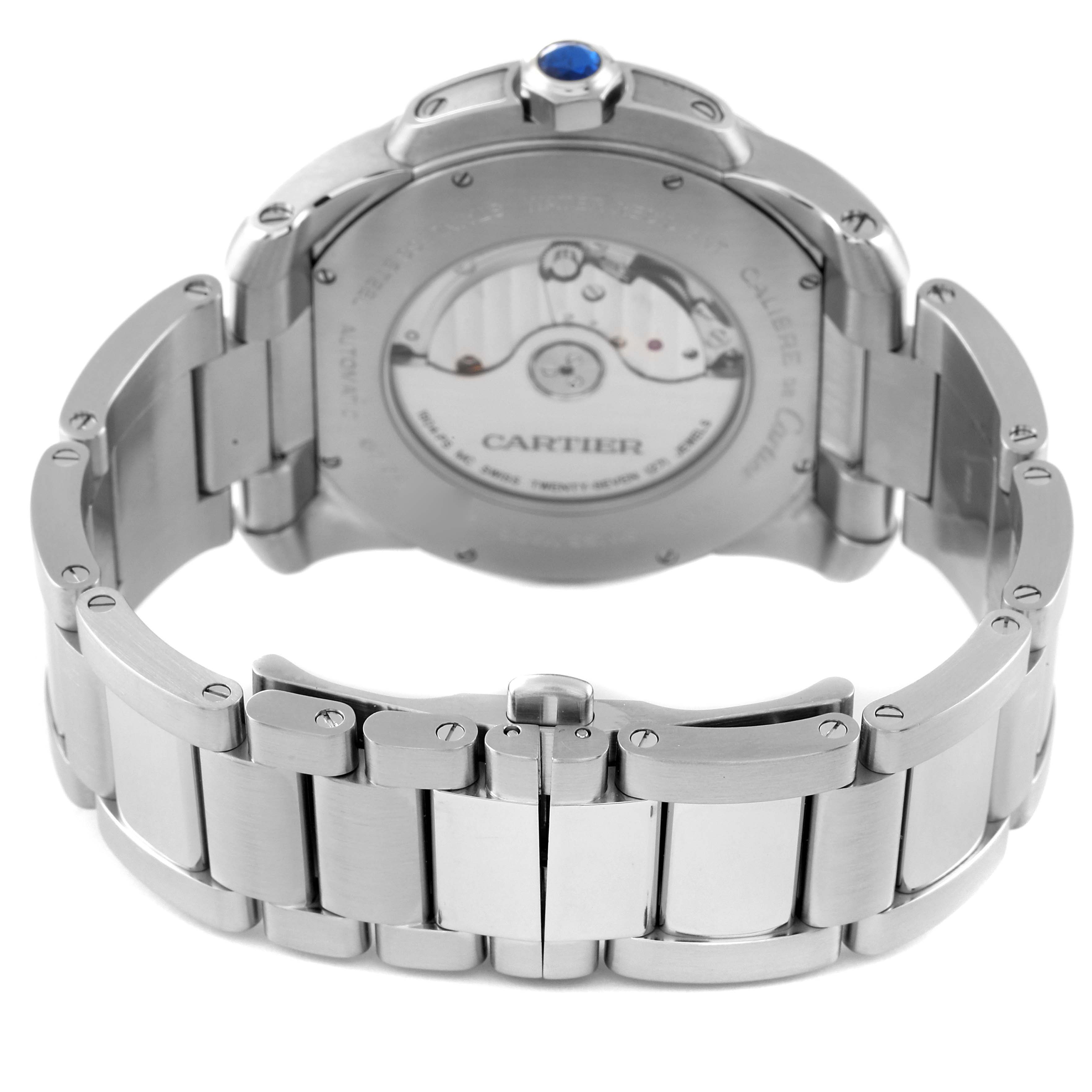 The image shows the back view of a Calibre de Cartier watch by Cartier, highlighting its movement and stainless steel bracelet.