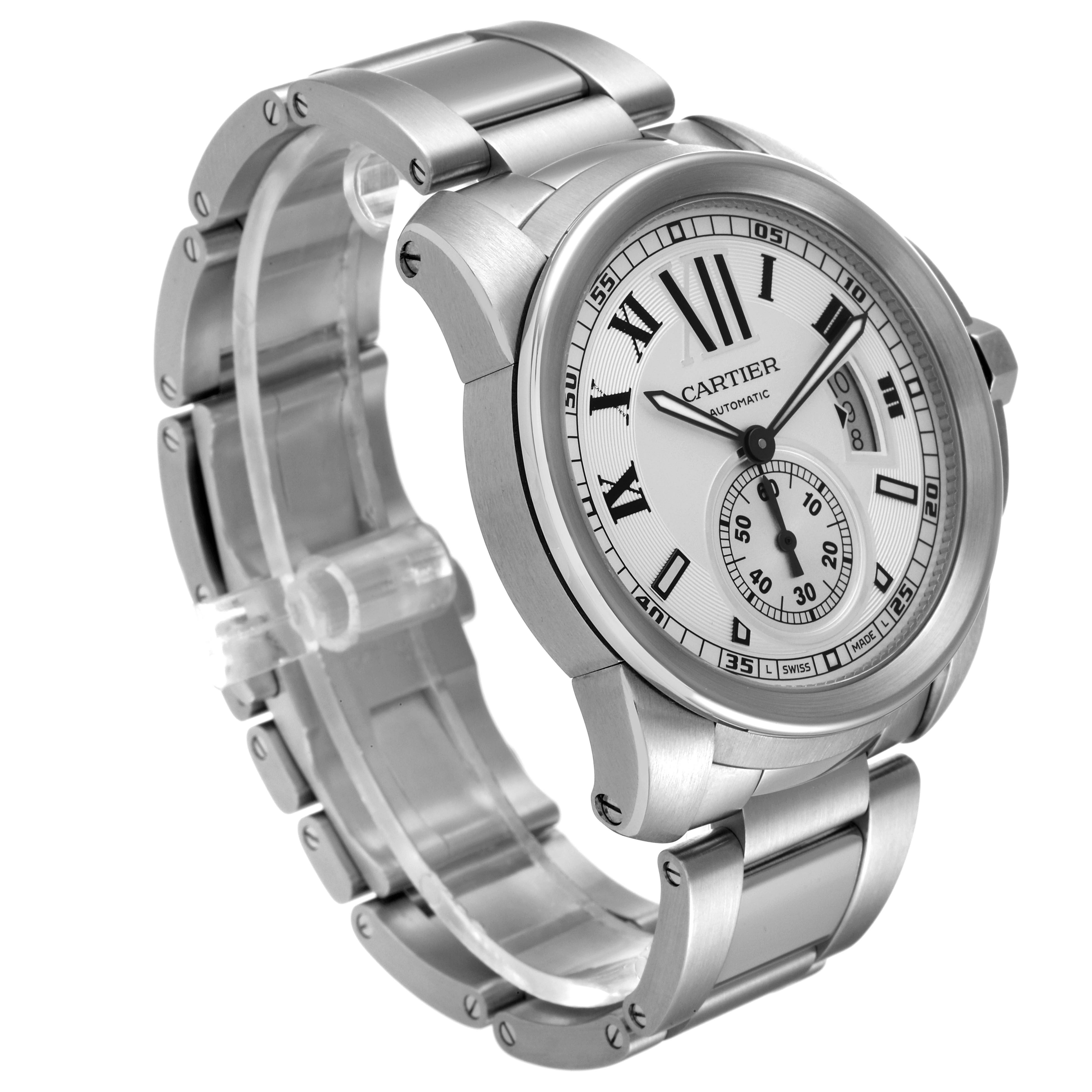 The image shows a Calibre de Cartier watch by Cartier at an angled view, highlighting the stainless steel case, bracelet, and dial.