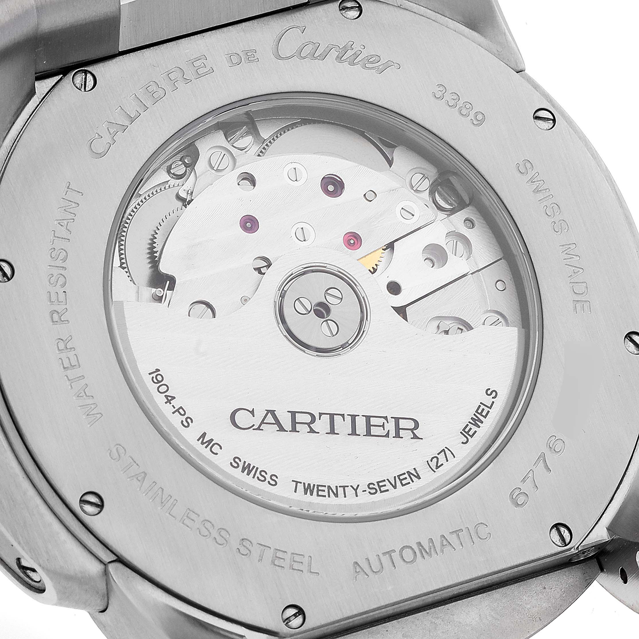 This image shows the back side of the Calibre de Cartier watch, highlighting its movement and engravings.