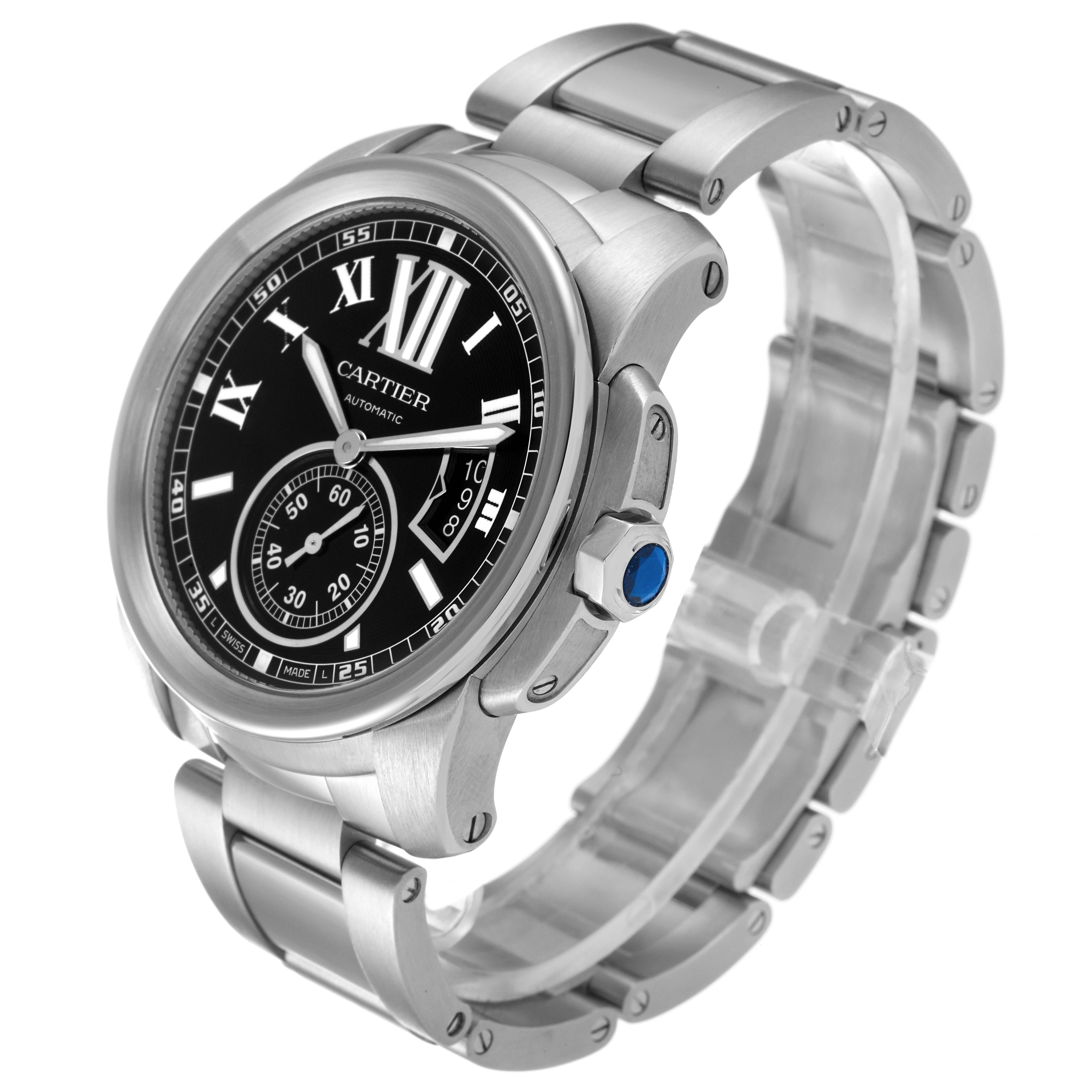 The Calibre de Cartier watch is shown at an angle, displaying the face, bezel, crown, and metal bracelet.