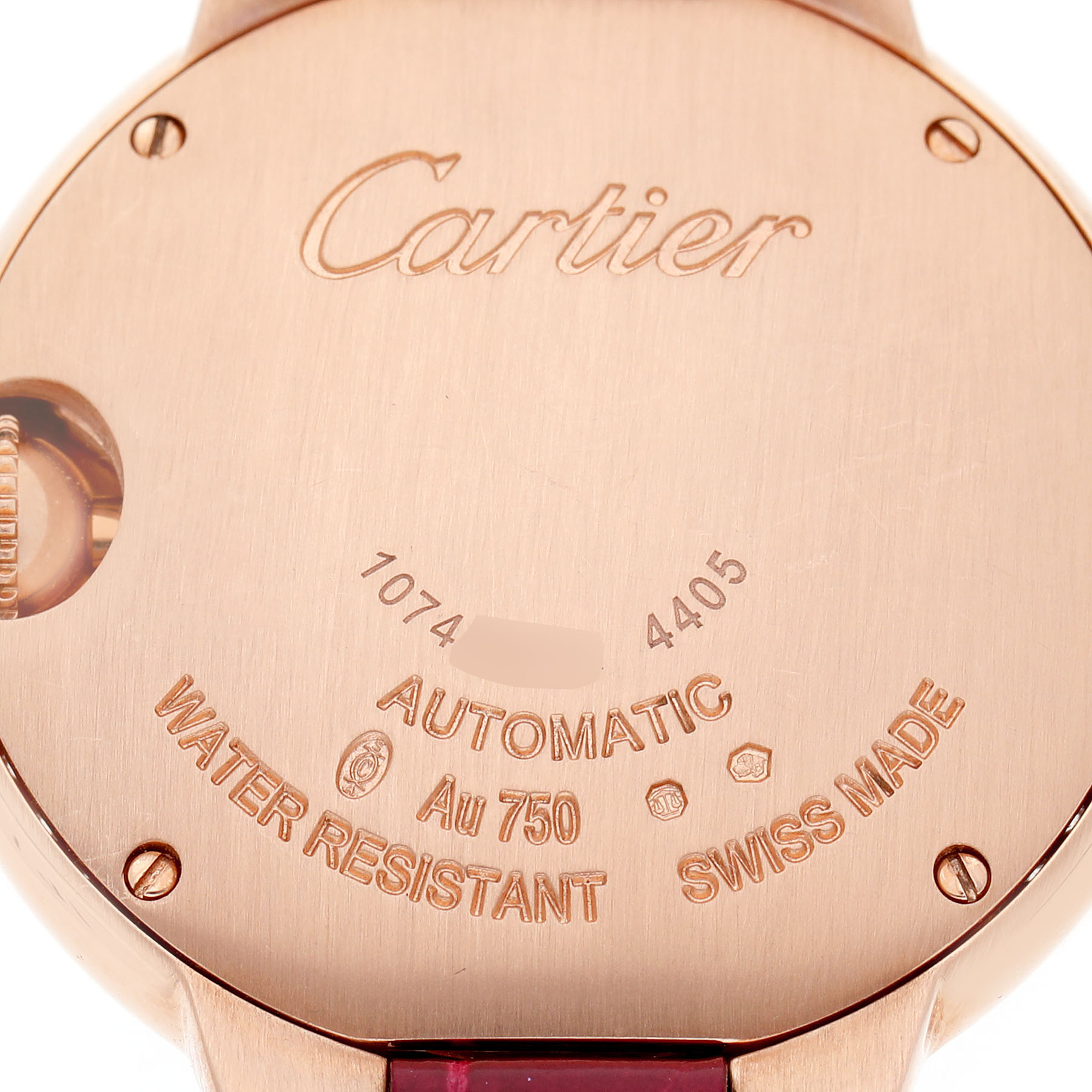 The image shows the back case of a Cartier Ballon Bleu WJBB0080 Women's Rose Gold Silver Dial watch, highlighting the engraved details and markings.